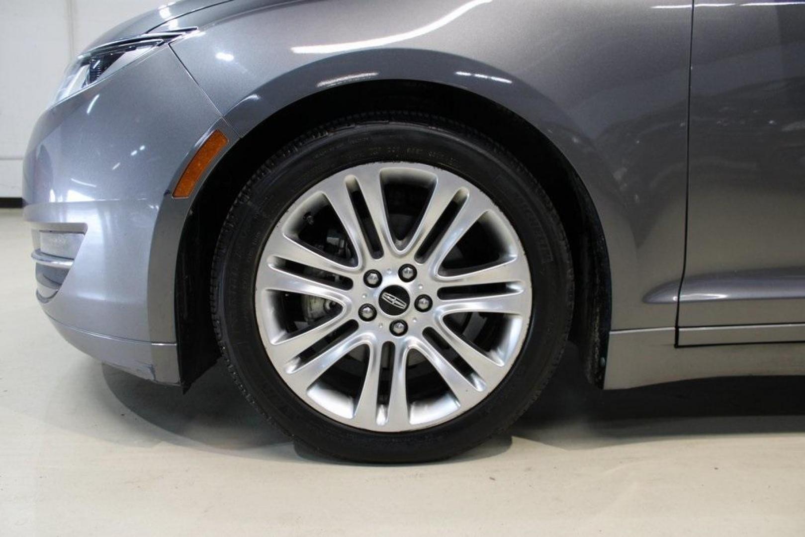 2014 Sterling Gray Metallic /Hazelnut Lincoln MKZ Hybrid (3LN6L2LUXER) with an 2.0L I4 Atkinson-Cycle iVCT engine, CVT transmission, located at 15300 Midway Rd., Addison, TX, 75001, (972) 702-0011, 32.958321, -96.838074 - Photo#4