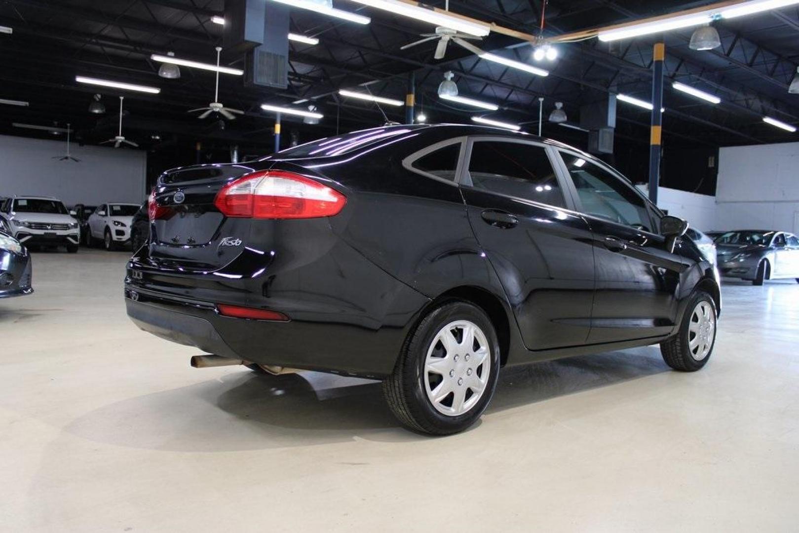 2018 Shadow Black /Charcoal Black Ford Fiesta S (3FADP4AJ3JM) with an 1.6L I4 Ti-VCT engine, Automatic transmission, located at 15300 Midway Rd., Addison, TX, 75001, (972) 702-0011, 32.958321, -96.838074 - Introducing the 2018 Ford Fiesta SE, now available at Midway Auto Group in Addison, Texas. This compact sedan combines efficiency, modern features, and a spirited driving experience, making it an excellent choice for both city commutes and weekend adventures.<br><br>Key Features:<br><br>Engine: 1.6L - Photo#2