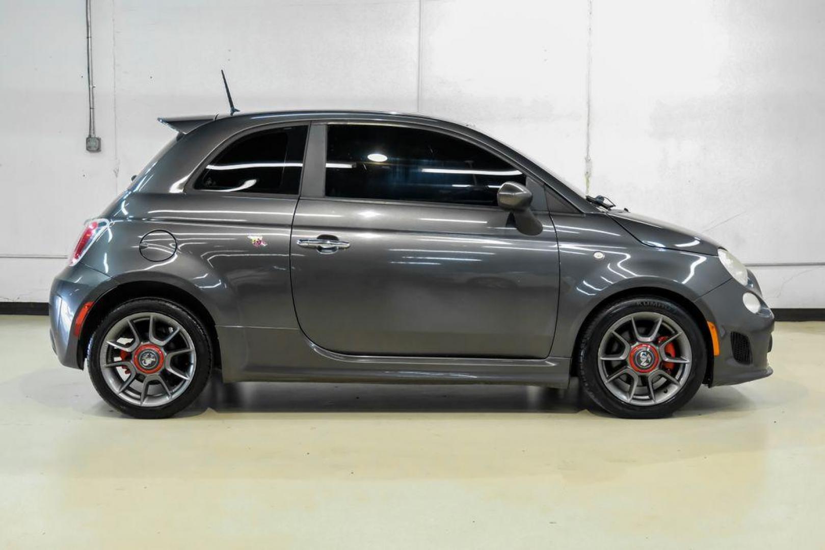 2015 Granito Lucente (Granite Crystal) /Black Fiat 500 Abarth (3C3CFFFH5FT) with an 1.4L I4 16V MultiAir Turbocharged engine, Automatic transmission, located at 15300 Midway Rd., Addison, TX, 75001, (972) 702-0011, 32.958321, -96.838074 - Photo#6