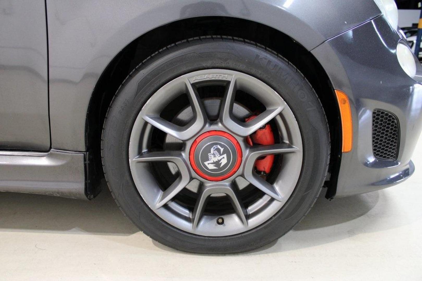 2015 Granito Lucente (Granite Crystal) /Black Fiat 500 Abarth (3C3CFFFH5FT) with an 1.4L I4 16V MultiAir Turbocharged engine, Automatic transmission, located at 15300 Midway Rd., Addison, TX, 75001, (972) 702-0011, 32.958321, -96.838074 - HOME OF THE NO HAGGLE PRICE - WHOLESALE PRICES TO THE PUBLIC!! 500 Abarth, 2D Hatchback, 1.4L I4 16V MultiAir Turbocharged, 6-Speed Automatic, FWD, Granito Lucente (Granite Crystal), Black Cloth.<br><br>Granito Lucente (Granite Crystal) 2015 Fiat 500 Abarth<br><br>24/32 City/Highway MPG<br><br>Award - Photo#11