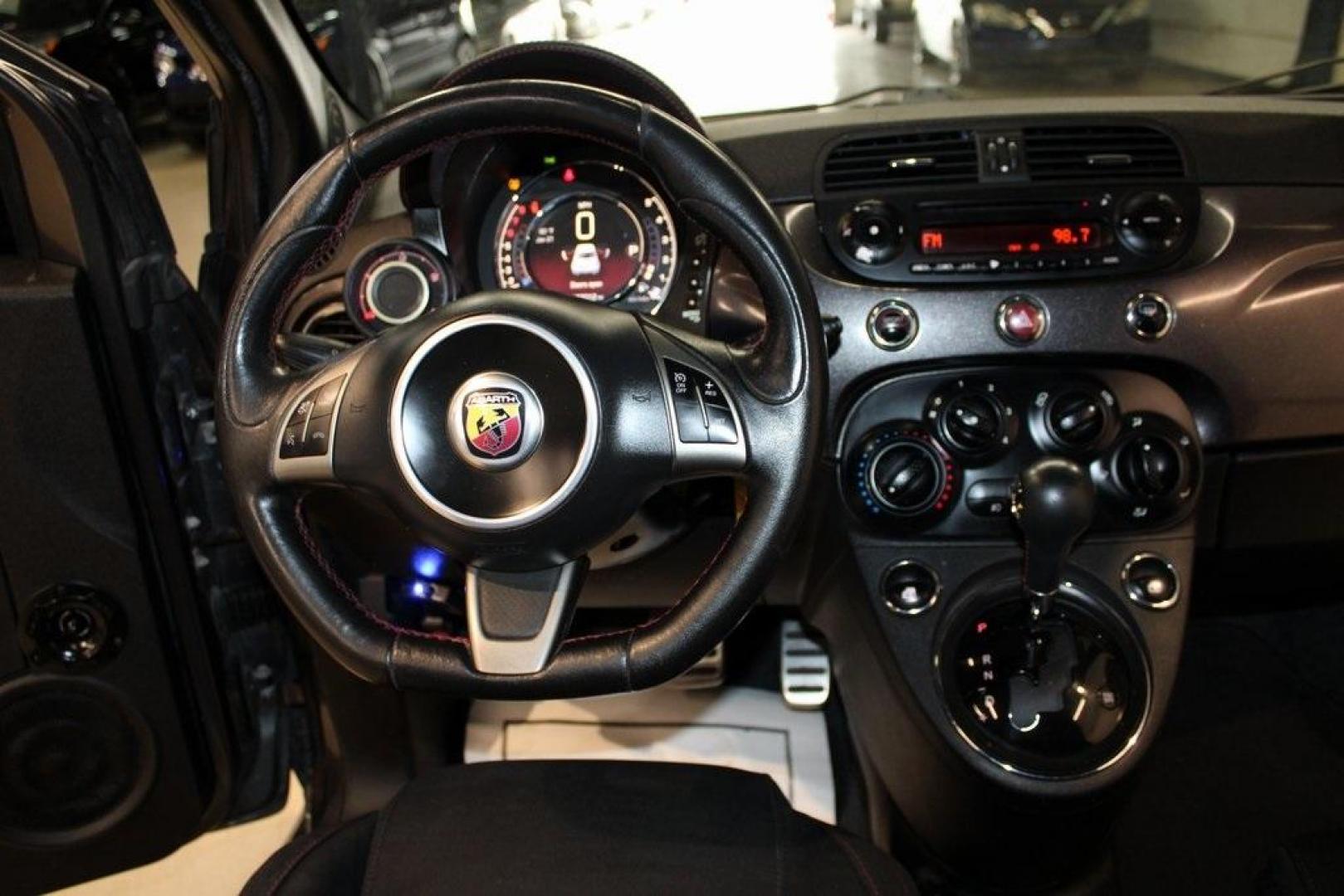 2015 Granito Lucente (Granite Crystal) /Black Fiat 500 Abarth (3C3CFFFH5FT) with an 1.4L I4 16V MultiAir Turbocharged engine, Automatic transmission, located at 15300 Midway Rd., Addison, TX, 75001, (972) 702-0011, 32.958321, -96.838074 - HOME OF THE NO HAGGLE PRICE - WHOLESALE PRICES TO THE PUBLIC!! 500 Abarth, 2D Hatchback, 1.4L I4 16V MultiAir Turbocharged, 6-Speed Automatic, FWD, Granito Lucente (Granite Crystal), Black Cloth.<br><br>Granito Lucente (Granite Crystal) 2015 Fiat 500 Abarth<br><br>24/32 City/Highway MPG<br><br>Award - Photo#16
