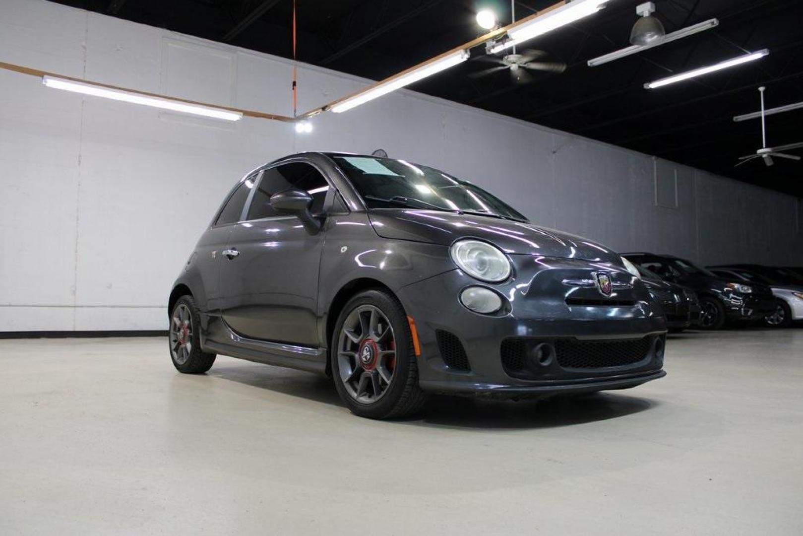 2015 Granito Lucente (Granite Crystal) /Black Fiat 500 Abarth (3C3CFFFH5FT) with an 1.4L I4 16V MultiAir Turbocharged engine, Automatic transmission, located at 15300 Midway Rd., Addison, TX, 75001, (972) 702-0011, 32.958321, -96.838074 - HOME OF THE NO HAGGLE PRICE - WHOLESALE PRICES TO THE PUBLIC!! 500 Abarth, 2D Hatchback, 1.4L I4 16V MultiAir Turbocharged, 6-Speed Automatic, FWD, Granito Lucente (Granite Crystal), Black Cloth.<br><br>Granito Lucente (Granite Crystal) 2015 Fiat 500 Abarth<br><br>24/32 City/Highway MPG<br><br>Award - Photo#1