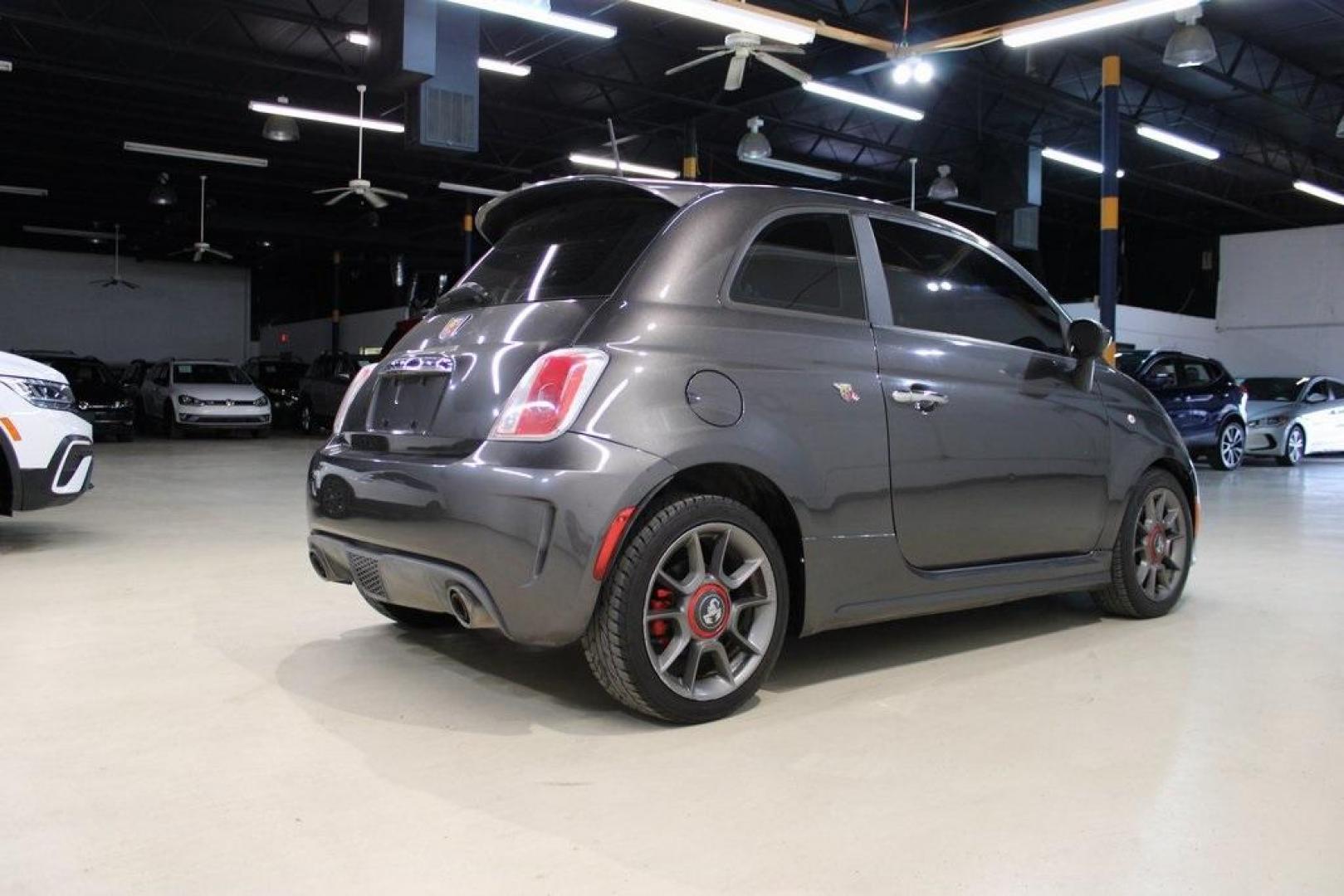 2015 Granito Lucente (Granite Crystal) /Black Fiat 500 Abarth (3C3CFFFH5FT) with an 1.4L I4 16V MultiAir Turbocharged engine, Automatic transmission, located at 15300 Midway Rd., Addison, TX, 75001, (972) 702-0011, 32.958321, -96.838074 - HOME OF THE NO HAGGLE PRICE - WHOLESALE PRICES TO THE PUBLIC!! 500 Abarth, 2D Hatchback, 1.4L I4 16V MultiAir Turbocharged, 6-Speed Automatic, FWD, Granito Lucente (Granite Crystal), Black Cloth.<br><br>Granito Lucente (Granite Crystal) 2015 Fiat 500 Abarth<br><br>24/32 City/Highway MPG<br><br>Award - Photo#2