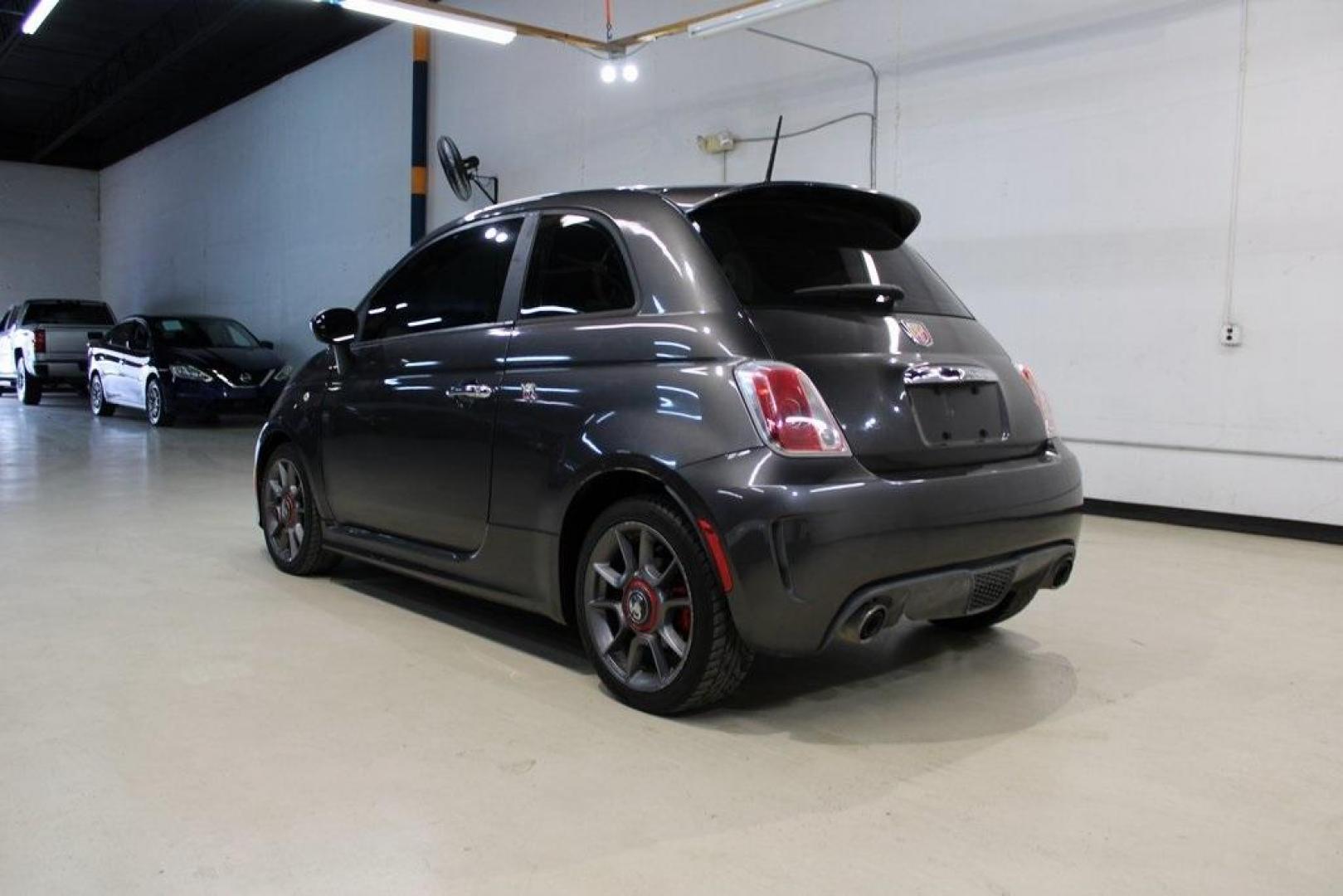 2015 Granito Lucente (Granite Crystal) /Black Fiat 500 Abarth (3C3CFFFH5FT) with an 1.4L I4 16V MultiAir Turbocharged engine, Automatic transmission, located at 15300 Midway Rd., Addison, TX, 75001, (972) 702-0011, 32.958321, -96.838074 - HOME OF THE NO HAGGLE PRICE - WHOLESALE PRICES TO THE PUBLIC!! 500 Abarth, 2D Hatchback, 1.4L I4 16V MultiAir Turbocharged, 6-Speed Automatic, FWD, Granito Lucente (Granite Crystal), Black Cloth.<br><br>Granito Lucente (Granite Crystal) 2015 Fiat 500 Abarth<br><br>24/32 City/Highway MPG<br><br>Award - Photo#3