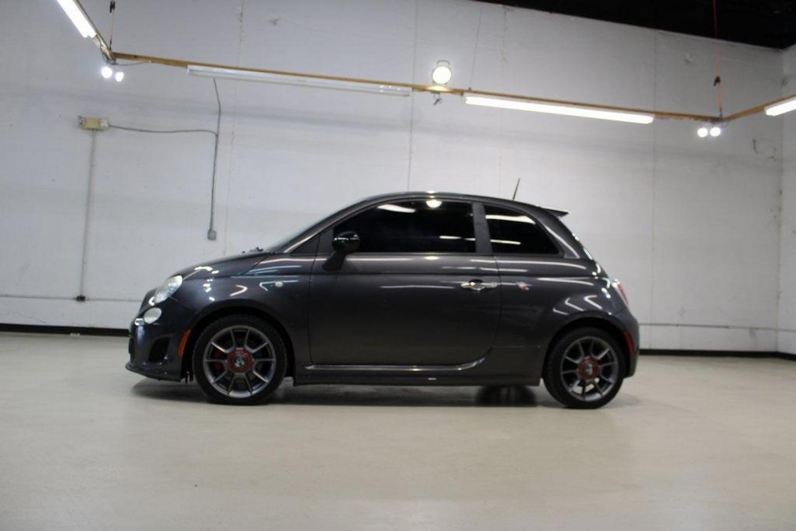 2015 Granito Lucente (Granite Crystal) /Black Fiat 500 Abarth (3C3CFFFH5FT) with an 1.4L I4 16V MultiAir Turbocharged engine, Automatic transmission, located at 15300 Midway Rd., Addison, TX, 75001, (972) 702-0011, 32.958321, -96.838074 - HOME OF THE NO HAGGLE PRICE - WHOLESALE PRICES TO THE PUBLIC!! 500 Abarth, 2D Hatchback, 1.4L I4 16V MultiAir Turbocharged, 6-Speed Automatic, FWD, Granito Lucente (Granite Crystal), Black Cloth.<br><br>Granito Lucente (Granite Crystal) 2015 Fiat 500 Abarth<br><br>24/32 City/Highway MPG<br><br>Award - Photo#4