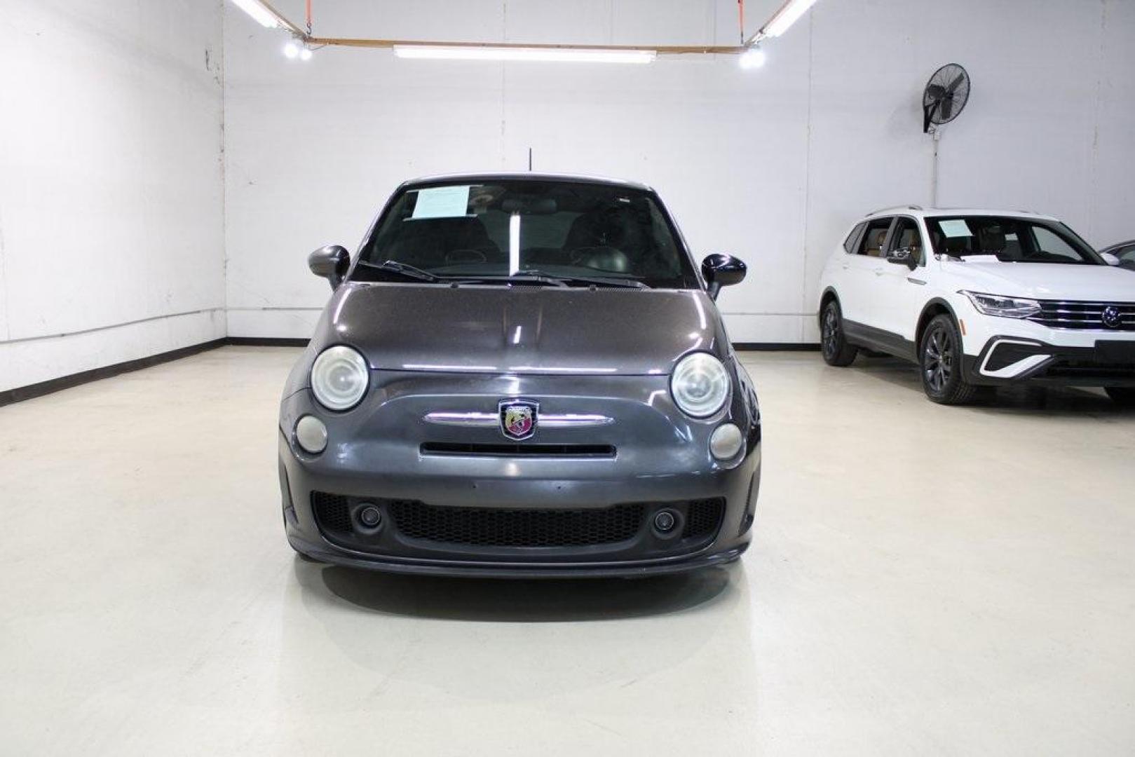 2015 Granito Lucente (Granite Crystal) /Black Fiat 500 Abarth (3C3CFFFH5FT) with an 1.4L I4 16V MultiAir Turbocharged engine, Automatic transmission, located at 15300 Midway Rd., Addison, TX, 75001, (972) 702-0011, 32.958321, -96.838074 - HOME OF THE NO HAGGLE PRICE - WHOLESALE PRICES TO THE PUBLIC!! 500 Abarth, 2D Hatchback, 1.4L I4 16V MultiAir Turbocharged, 6-Speed Automatic, FWD, Granito Lucente (Granite Crystal), Black Cloth.<br><br>Granito Lucente (Granite Crystal) 2015 Fiat 500 Abarth<br><br>24/32 City/Highway MPG<br><br>Award - Photo#5