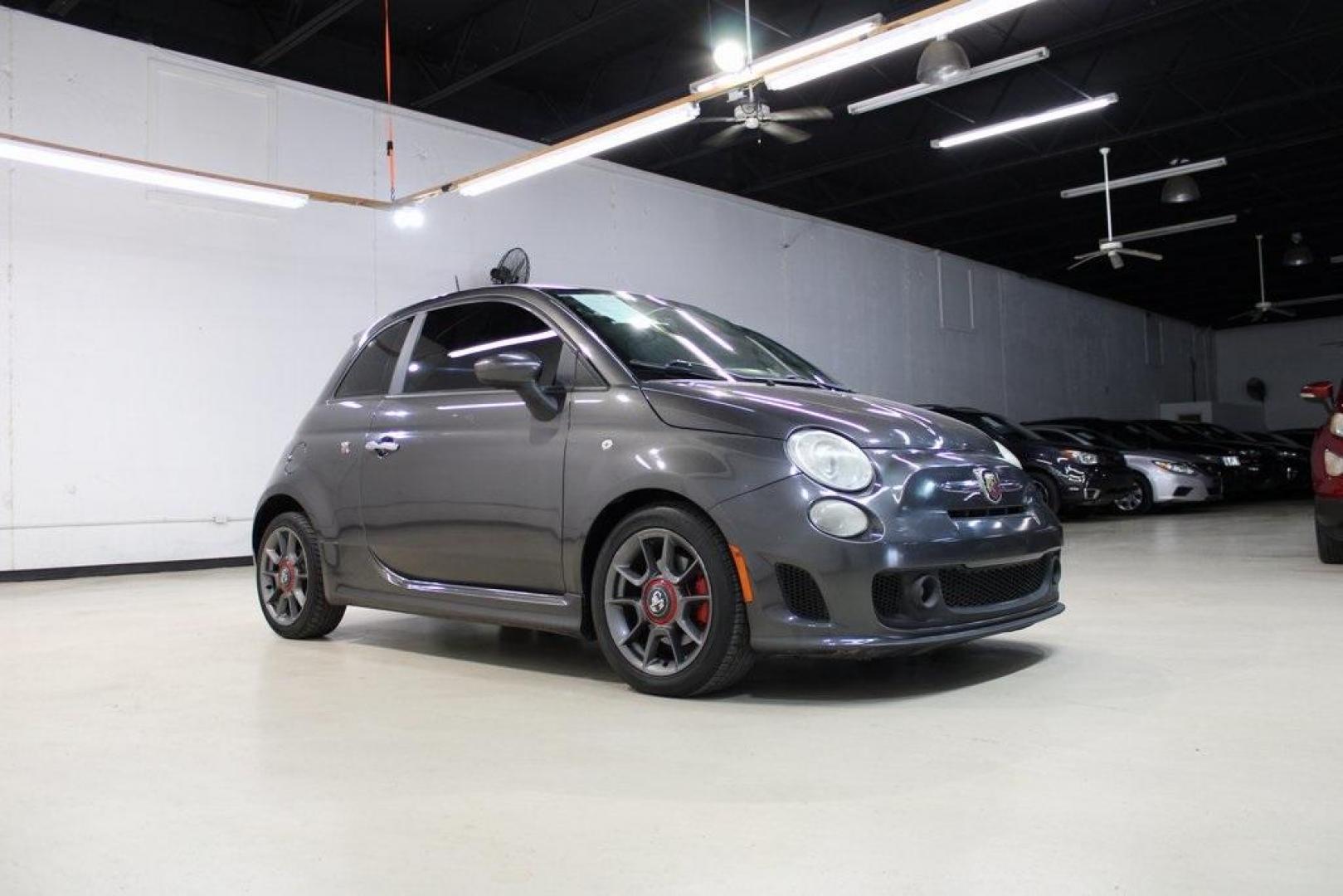 2015 Granito Lucente (Granite Crystal) /Black Fiat 500 Abarth (3C3CFFFH5FT) with an 1.4L I4 16V MultiAir Turbocharged engine, Automatic transmission, located at 15300 Midway Rd., Addison, TX, 75001, (972) 702-0011, 32.958321, -96.838074 - HOME OF THE NO HAGGLE PRICE - WHOLESALE PRICES TO THE PUBLIC!! 500 Abarth, 2D Hatchback, 1.4L I4 16V MultiAir Turbocharged, 6-Speed Automatic, FWD, Granito Lucente (Granite Crystal), Black Cloth.<br><br>Granito Lucente (Granite Crystal) 2015 Fiat 500 Abarth<br><br>24/32 City/Highway MPG<br><br>Award - Photo#6
