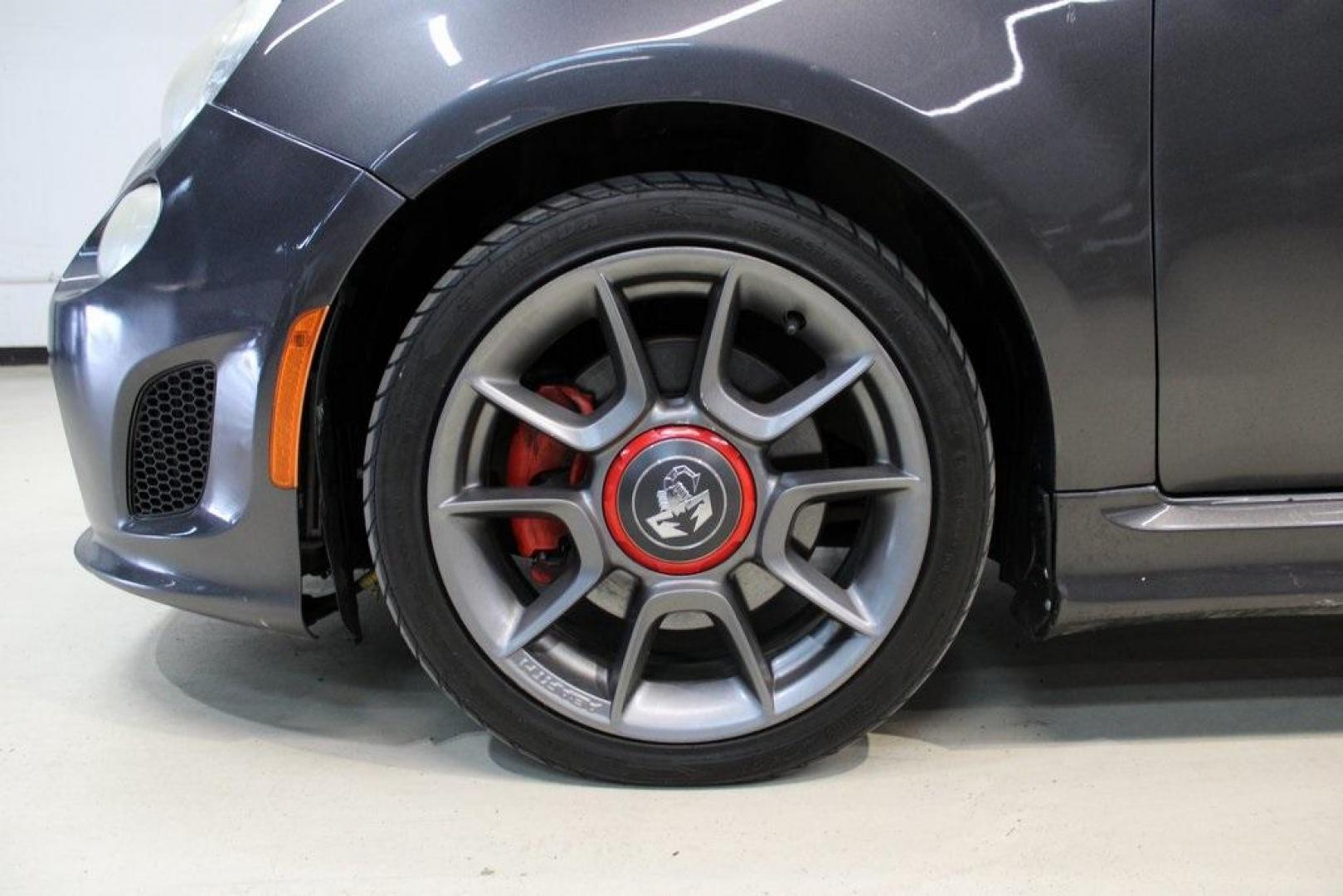 2015 Granito Lucente (Granite Crystal) /Black Fiat 500 Abarth (3C3CFFFH5FT) with an 1.4L I4 16V MultiAir Turbocharged engine, Automatic transmission, located at 15300 Midway Rd., Addison, TX, 75001, (972) 702-0011, 32.958321, -96.838074 - HOME OF THE NO HAGGLE PRICE - WHOLESALE PRICES TO THE PUBLIC!! 500 Abarth, 2D Hatchback, 1.4L I4 16V MultiAir Turbocharged, 6-Speed Automatic, FWD, Granito Lucente (Granite Crystal), Black Cloth.<br><br>Granito Lucente (Granite Crystal) 2015 Fiat 500 Abarth<br><br>24/32 City/Highway MPG<br><br>Award - Photo#8