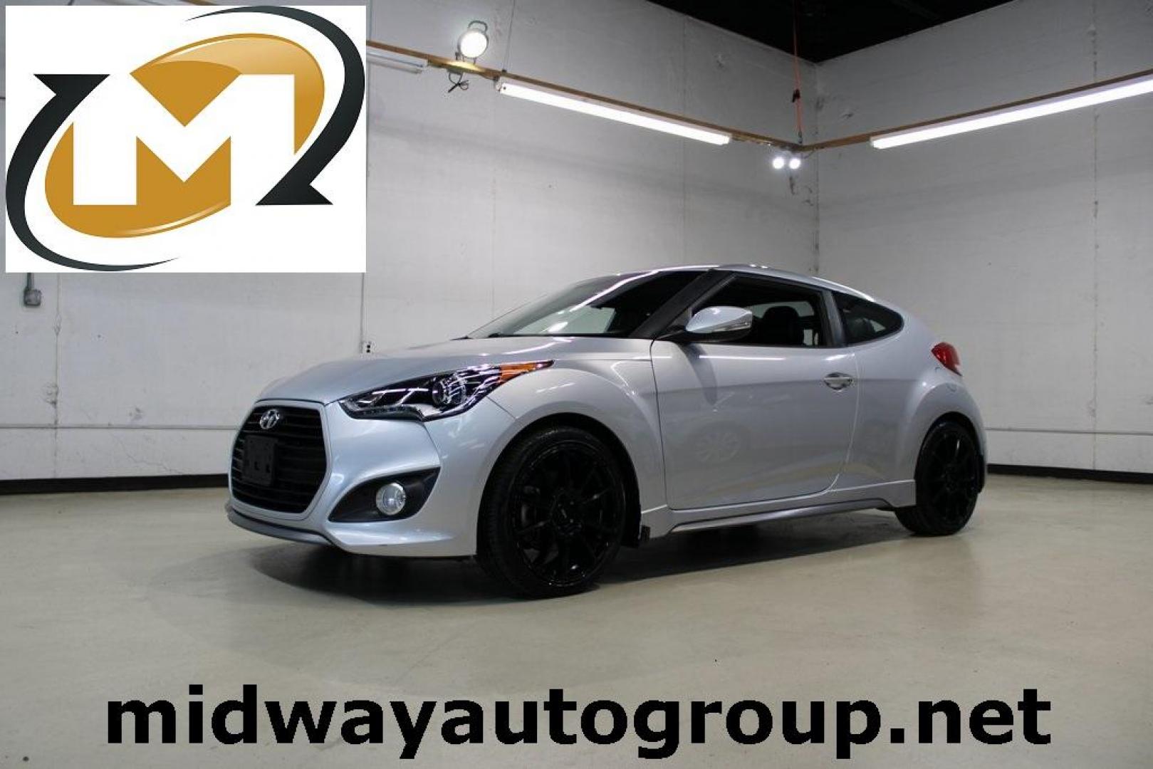 2014 Ironman Silver Metallic /Black Hyundai Veloster Turbo (KMHTC6AEXEU) with an 1.6L I4 DGI DOHC 16V Turbocharged engine, Manual transmission, located at 15300 Midway Rd., Addison, TX, 75001, (972) 702-0011, 32.958321, -96.838074 - Introducing the 2014 Hyundai Veloster Turbo, now available at Midway Auto Group in Addison, Texas. This distinctive hatchback combines sporty performance with innovative design, offering a driving experience that's both exhilarating and practical.<br><br>Key Features:<br><br>Engine: 1.6L Turbocharge - Photo#0