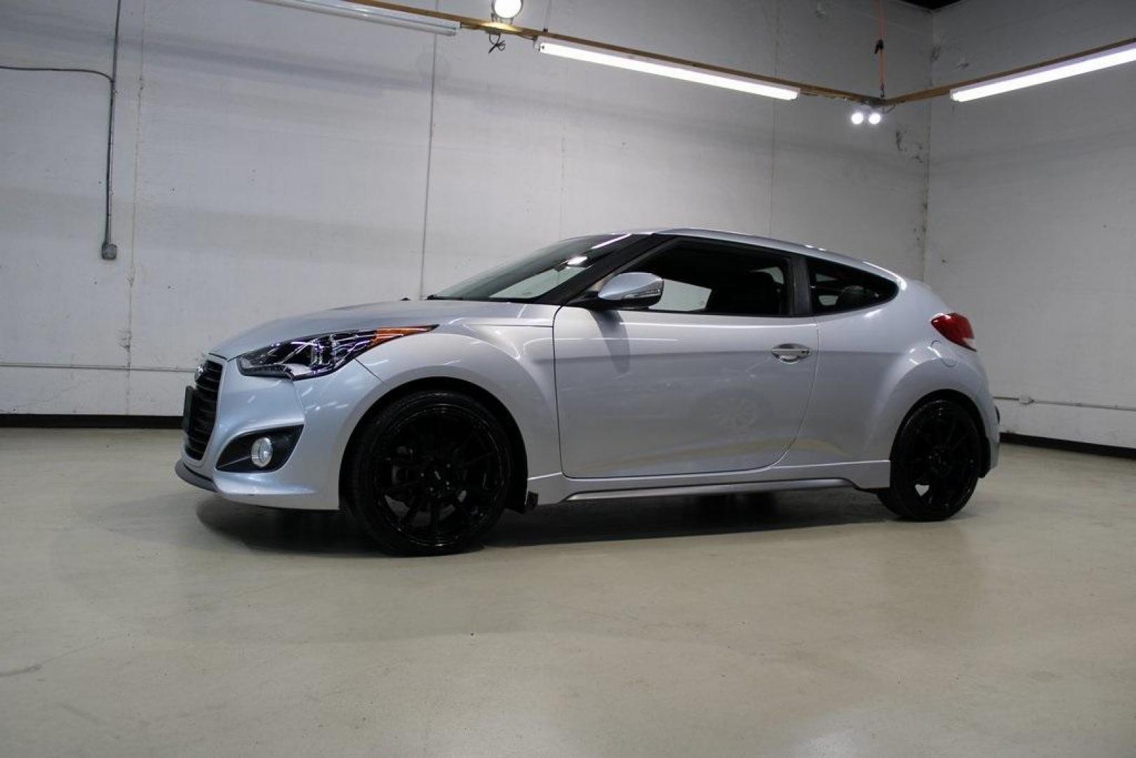 2014 Ironman Silver Metallic /Black Hyundai Veloster Turbo (KMHTC6AEXEU) with an 1.6L I4 DGI DOHC 16V Turbocharged engine, Manual transmission, located at 15300 Midway Rd., Addison, TX, 75001, (972) 702-0011, 32.958321, -96.838074 - Introducing the 2014 Hyundai Veloster Turbo, now available at Midway Auto Group in Addison, Texas. This distinctive hatchback combines sporty performance with innovative design, offering a driving experience that's both exhilarating and practical.<br><br>Key Features:<br><br>Engine: 1.6L Turbocharge - Photo#4