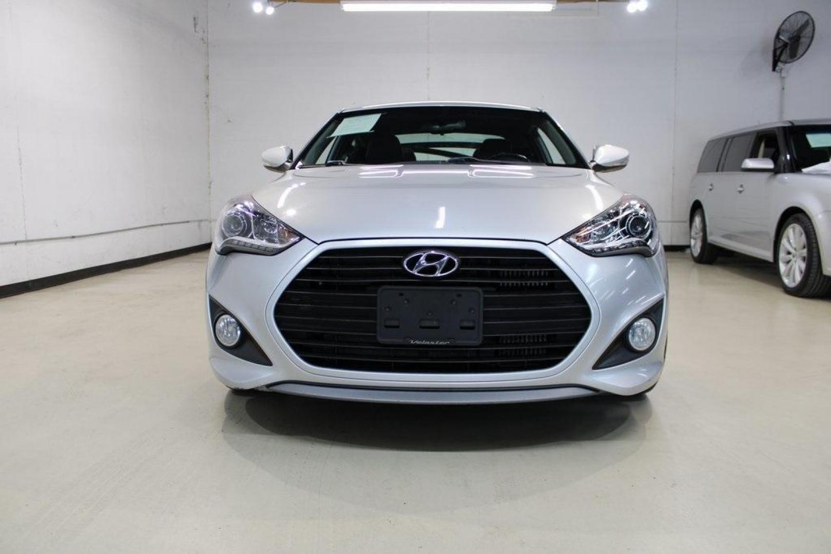 2014 Ironman Silver Metallic /Black Hyundai Veloster Turbo (KMHTC6AEXEU) with an 1.6L I4 DGI DOHC 16V Turbocharged engine, Manual transmission, located at 15300 Midway Rd., Addison, TX, 75001, (972) 702-0011, 32.958321, -96.838074 - Introducing the 2014 Hyundai Veloster Turbo, now available at Midway Auto Group in Addison, Texas. This distinctive hatchback combines sporty performance with innovative design, offering a driving experience that's both exhilarating and practical.<br><br>Key Features:<br><br>Engine: 1.6L Turbocharge - Photo#5
