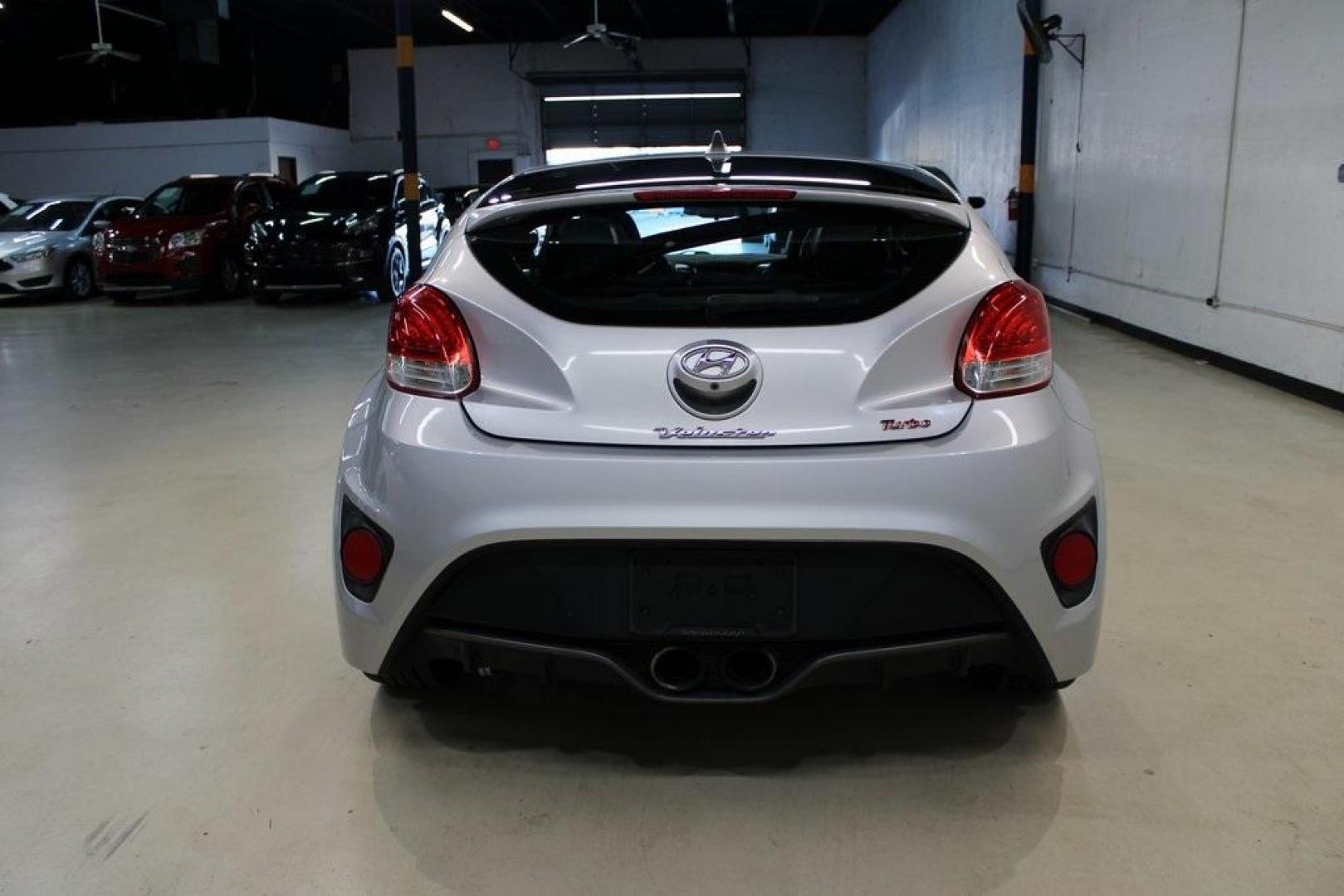 2014 Ironman Silver Metallic /Black Hyundai Veloster Turbo (KMHTC6AEXEU) with an 1.6L I4 DGI DOHC 16V Turbocharged engine, Manual transmission, located at 15300 Midway Rd., Addison, TX, 75001, (972) 702-0011, 32.958321, -96.838074 - Introducing the 2014 Hyundai Veloster Turbo, now available at Midway Auto Group in Addison, Texas. This distinctive hatchback combines sporty performance with innovative design, offering a driving experience that's both exhilarating and practical.<br><br>Key Features:<br><br>Engine: 1.6L Turbocharge - Photo#7