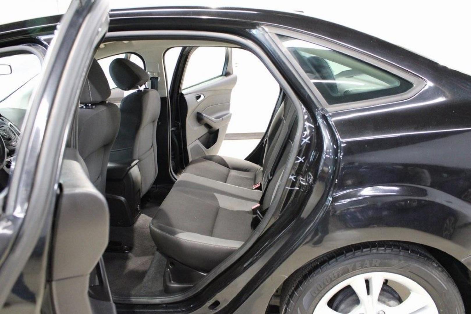 2014 Tuxedo Black Metallic /Black Ford Focus SE (1FADP3F26EL) with an 2.0L 4-Cylinder DGI Flex Fuel DOHC engine, Automatic transmission, located at 15300 Midway Rd., Addison, TX, 75001, (972) 702-0011, 32.958321, -96.838074 - Introducing the 2014 Ford Focus SE, now available at Midway Auto Group in Addison, Texas. This compact sedan offers a harmonious blend of efficiency, comfort, and modern features, making it an excellent choice for daily commutes and city driving.<br><br>Key Features:<br><br>Engine: 2.0L 4-Cylinder<b - Photo#15