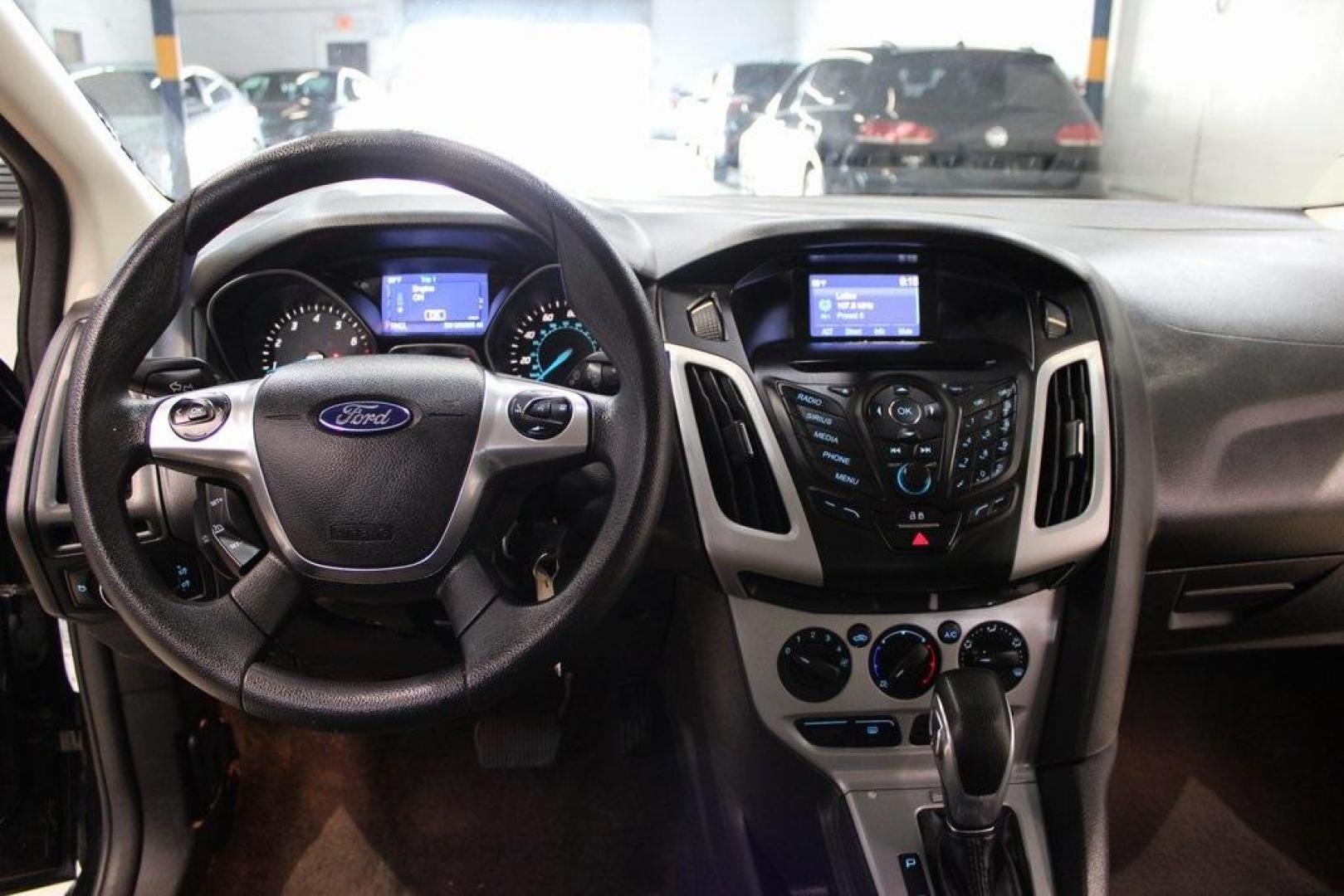 2014 Tuxedo Black Metallic /Black Ford Focus SE (1FADP3F26EL) with an 2.0L 4-Cylinder DGI Flex Fuel DOHC engine, Automatic transmission, located at 15300 Midway Rd., Addison, TX, 75001, (972) 702-0011, 32.958321, -96.838074 - Introducing the 2014 Ford Focus SE, now available at Midway Auto Group in Addison, Texas. This compact sedan offers a harmonious blend of efficiency, comfort, and modern features, making it an excellent choice for daily commutes and city driving.<br><br>Key Features:<br><br>Engine: 2.0L 4-Cylinder<b - Photo#16