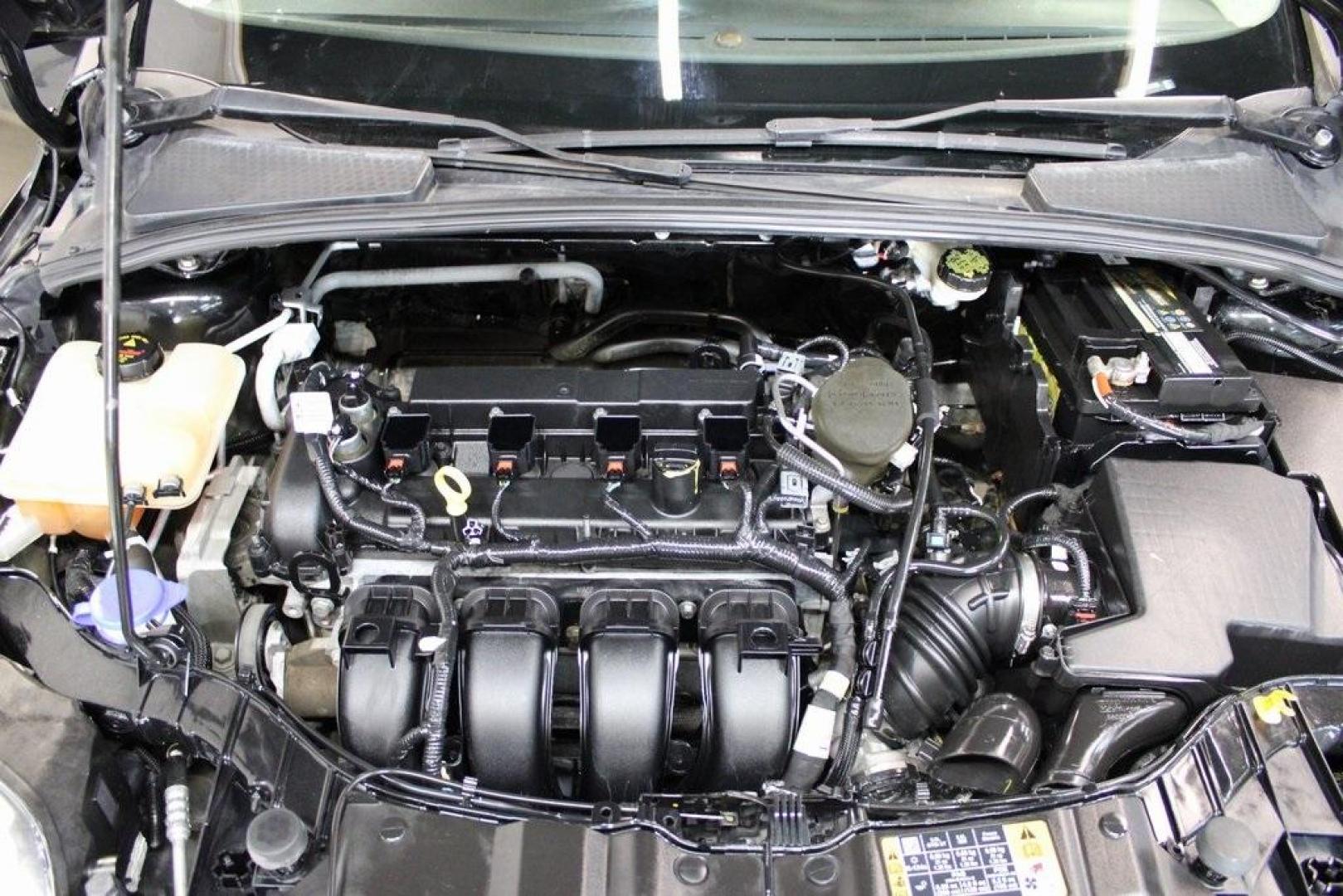 2014 Tuxedo Black Metallic /Black Ford Focus SE (1FADP3F26EL) with an 2.0L 4-Cylinder DGI Flex Fuel DOHC engine, Automatic transmission, located at 15300 Midway Rd., Addison, TX, 75001, (972) 702-0011, 32.958321, -96.838074 - Introducing the 2014 Ford Focus SE, now available at Midway Auto Group in Addison, Texas. This compact sedan offers a harmonious blend of efficiency, comfort, and modern features, making it an excellent choice for daily commutes and city driving.<br><br>Key Features:<br><br>Engine: 2.0L 4-Cylinder<b - Photo#25