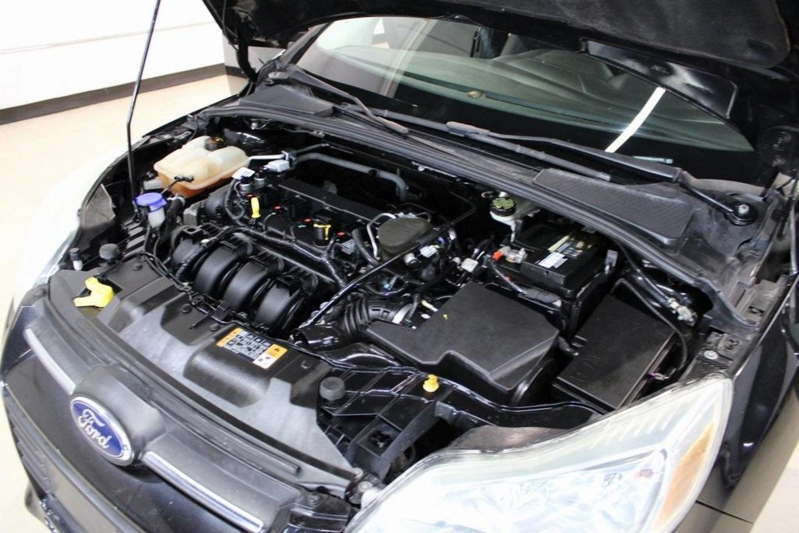 2014 Tuxedo Black Metallic /Black Ford Focus SE (1FADP3F26EL) with an 2.0L 4-Cylinder DGI Flex Fuel DOHC engine, Automatic transmission, located at 15300 Midway Rd., Addison, TX, 75001, (972) 702-0011, 32.958321, -96.838074 - Introducing the 2014 Ford Focus SE, now available at Midway Auto Group in Addison, Texas. This compact sedan offers a harmonious blend of efficiency, comfort, and modern features, making it an excellent choice for daily commutes and city driving.<br><br>Key Features:<br><br>Engine: 2.0L 4-Cylinder<b - Photo#26