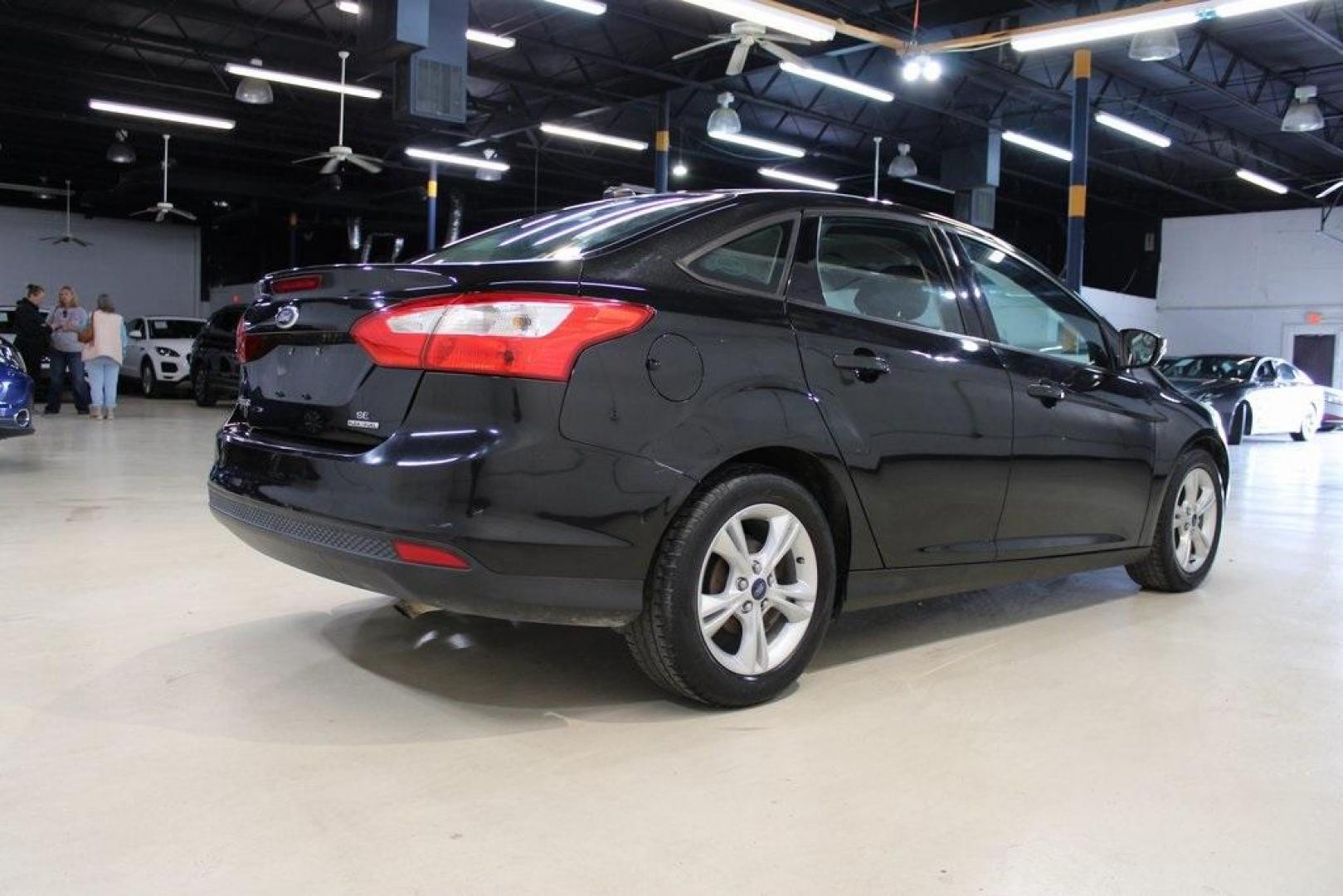 2014 Tuxedo Black Metallic /Black Ford Focus SE (1FADP3F26EL) with an 2.0L 4-Cylinder DGI Flex Fuel DOHC engine, Automatic transmission, located at 15300 Midway Rd., Addison, TX, 75001, (972) 702-0011, 32.958321, -96.838074 - Introducing the 2014 Ford Focus SE, now available at Midway Auto Group in Addison, Texas. This compact sedan offers a harmonious blend of efficiency, comfort, and modern features, making it an excellent choice for daily commutes and city driving.<br><br>Key Features:<br><br>Engine: 2.0L 4-Cylinder<b - Photo#2