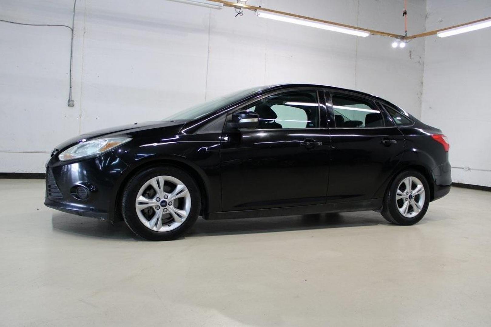 2014 Tuxedo Black Metallic /Black Ford Focus SE (1FADP3F26EL) with an 2.0L 4-Cylinder DGI Flex Fuel DOHC engine, Automatic transmission, located at 15300 Midway Rd., Addison, TX, 75001, (972) 702-0011, 32.958321, -96.838074 - Introducing the 2014 Ford Focus SE, now available at Midway Auto Group in Addison, Texas. This compact sedan offers a harmonious blend of efficiency, comfort, and modern features, making it an excellent choice for daily commutes and city driving.<br><br>Key Features:<br><br>Engine: 2.0L 4-Cylinder<b - Photo#4