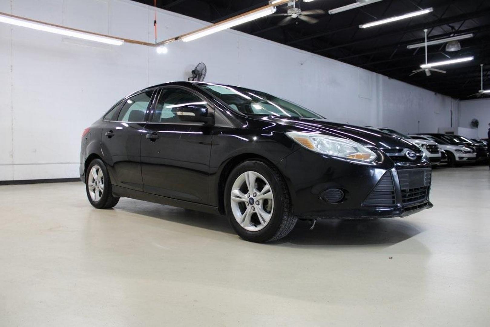 2014 Tuxedo Black Metallic /Black Ford Focus SE (1FADP3F26EL) with an 2.0L 4-Cylinder DGI Flex Fuel DOHC engine, Automatic transmission, located at 15300 Midway Rd., Addison, TX, 75001, (972) 702-0011, 32.958321, -96.838074 - Introducing the 2014 Ford Focus SE, now available at Midway Auto Group in Addison, Texas. This compact sedan offers a harmonious blend of efficiency, comfort, and modern features, making it an excellent choice for daily commutes and city driving.<br><br>Key Features:<br><br>Engine: 2.0L 4-Cylinder<b - Photo#6