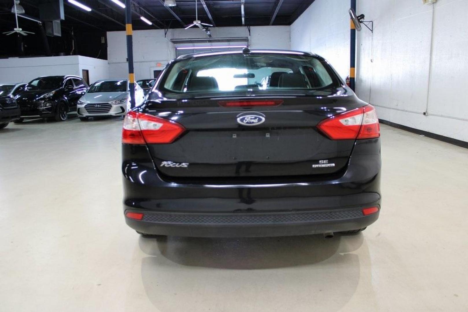2014 Tuxedo Black Metallic /Black Ford Focus SE (1FADP3F26EL) with an 2.0L 4-Cylinder DGI Flex Fuel DOHC engine, Automatic transmission, located at 15300 Midway Rd., Addison, TX, 75001, (972) 702-0011, 32.958321, -96.838074 - Introducing the 2014 Ford Focus SE, now available at Midway Auto Group in Addison, Texas. This compact sedan offers a harmonious blend of efficiency, comfort, and modern features, making it an excellent choice for daily commutes and city driving.<br><br>Key Features:<br><br>Engine: 2.0L 4-Cylinder<b - Photo#7