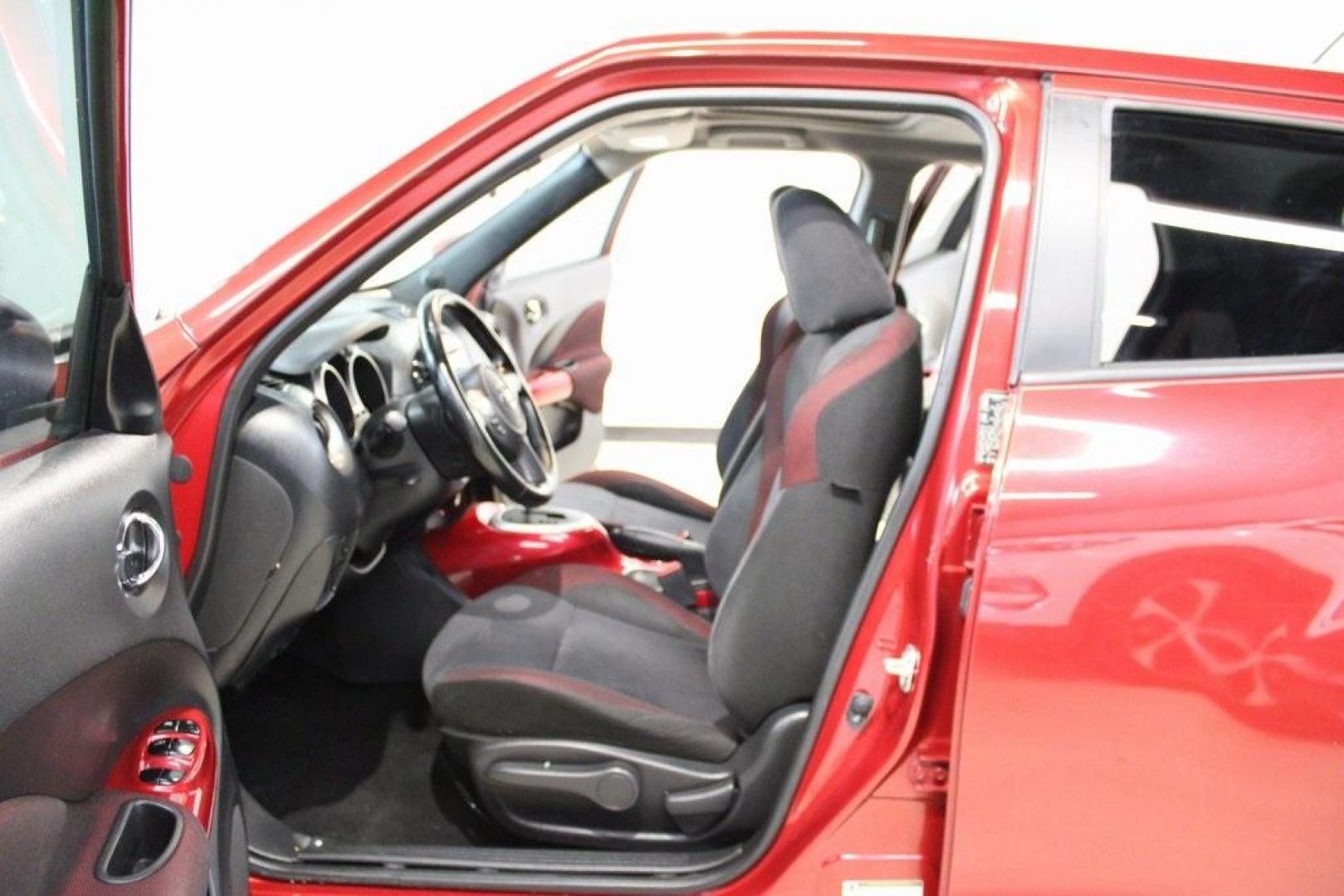 2015 Cayenne Red Pearl /Black/Red Nissan Juke SV (JN8AF5MR4FT) with an 1.6L I4 DOHC 16V engine, CVT transmission, located at 15300 Midway Rd., Addison, TX, 75001, (972) 702-0011, 32.958321, -96.838074 - HOME OF THE NO HAGGLE PRICE - WHOLESALE PRICES TO THE PUBLIC!! Juke SV, 4D Sport Utility, 1.6L I4 DOHC 16V, CVT with Xtronic, FWD, Cayenne Red Pearl, Black/Red Cloth.<br><br>Cayenne Red Pearl 2015 Nissan Juke SV<br><br>Recent Arrival! 28/32 City/Highway MPG<br><br><br>At Midway Auto Group, we strive - Photo#13