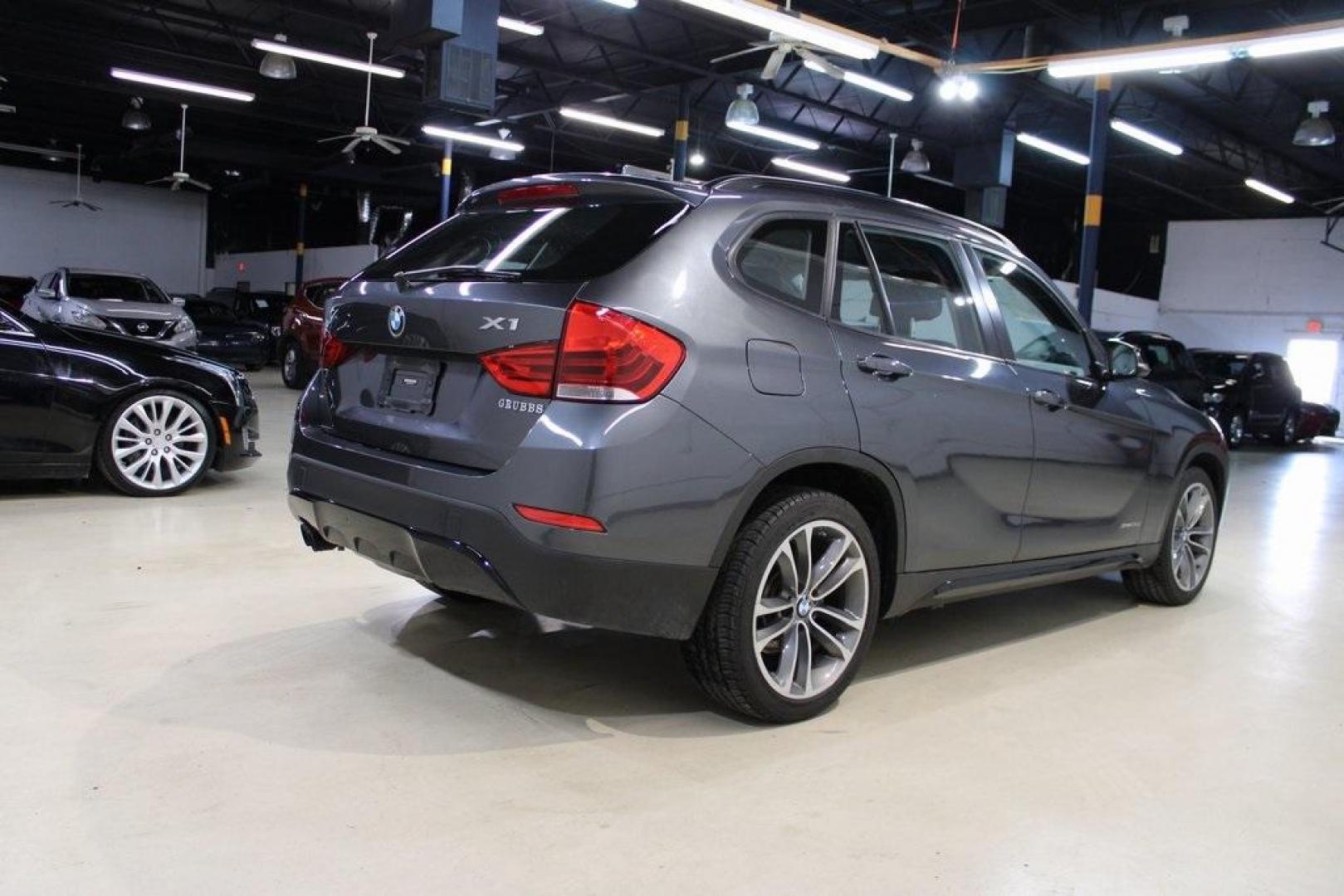 2015 Mineral Grey Metallic /Black BMW X1 xDrive28i (WBAVL1C56FV) with an 2.0L 4-Cylinder DOHC 16V TwinPower Turbo engine, Automatic transmission, located at 15300 Midway Rd., Addison, TX, 75001, (972) 702-0011, 32.958321, -96.838074 - Introducing the 2015 BMW X1 xDrive28i, now available at Midway Auto Group in Addison, Texas. This compact luxury SUV combines BMW's renowned performance with versatility and style, making it an excellent choice for both city driving and weekend adventures.<br><br>Key Features:<br><br>Engine: 2.0-lit - Photo#2