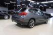 2015 Mineral Grey Metallic /Black BMW X1 xDrive28i (WBAVL1C56FV) with an 2.0L 4-Cylinder DOHC 16V TwinPower Turbo engine, Automatic transmission, located at 15300 Midway Rd., Addison, TX, 75001, (972) 702-0011, 32.958321, -96.838074 - Introducing the 2015 BMW X1 xDrive28i, now available at Midway Auto Group in Addison, Texas. This compact luxury SUV combines BMW's renowned performance with versatility and style, making it an excellent choice for both city driving and weekend adventures.<br><br>Key Features:<br><br>Engine: 2.0-lit - Photo#2