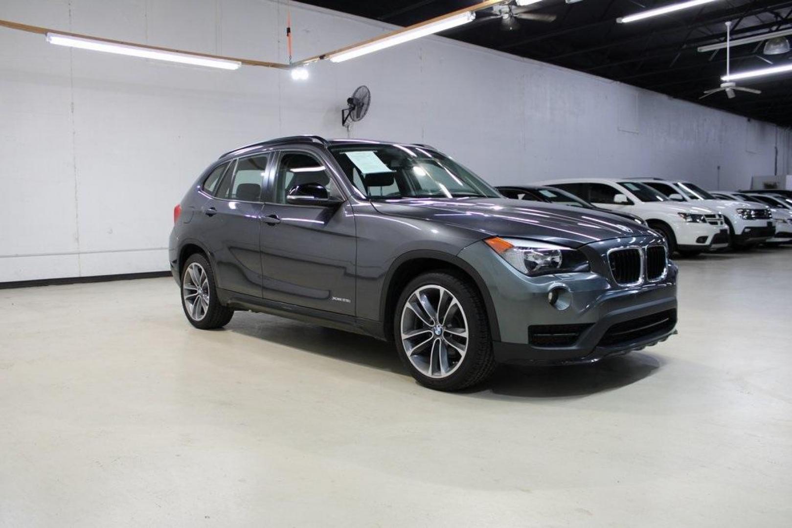 2015 Mineral Grey Metallic /Black BMW X1 xDrive28i (WBAVL1C56FV) with an 2.0L 4-Cylinder DOHC 16V TwinPower Turbo engine, Automatic transmission, located at 15300 Midway Rd., Addison, TX, 75001, (972) 702-0011, 32.958321, -96.838074 - Introducing the 2015 BMW X1 xDrive28i, now available at Midway Auto Group in Addison, Texas. This compact luxury SUV combines BMW's renowned performance with versatility and style, making it an excellent choice for both city driving and weekend adventures.<br><br>Key Features:<br><br>Engine: 2.0-lit - Photo#6