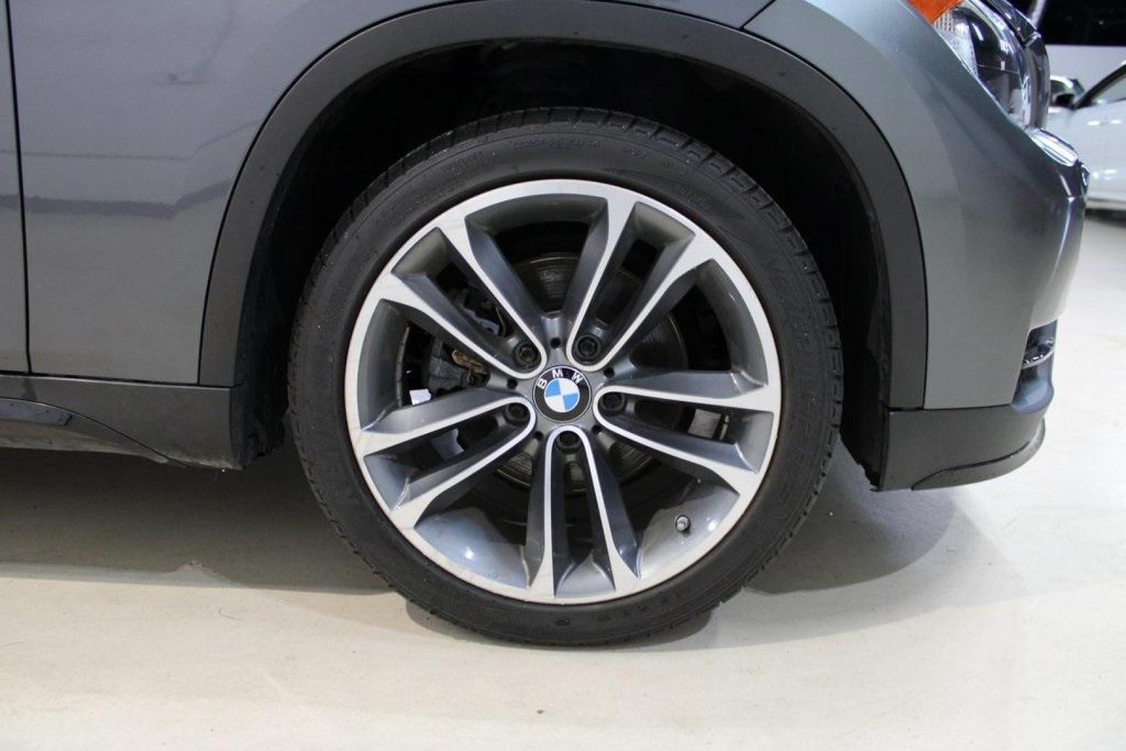 2015 Mineral Grey Metallic /Black BMW X1 xDrive28i (WBAVL1C56FV) with an 2.0L 4-Cylinder DOHC 16V TwinPower Turbo engine, Automatic transmission, located at 15300 Midway Rd., Addison, TX, 75001, (972) 702-0011, 32.958321, -96.838074 - Introducing the 2015 BMW X1 xDrive28i, now available at Midway Auto Group in Addison, Texas. This compact luxury SUV combines BMW's renowned performance with versatility and style, making it an excellent choice for both city driving and weekend adventures.<br><br>Key Features:<br><br>Engine: 2.0-lit - Photo#11