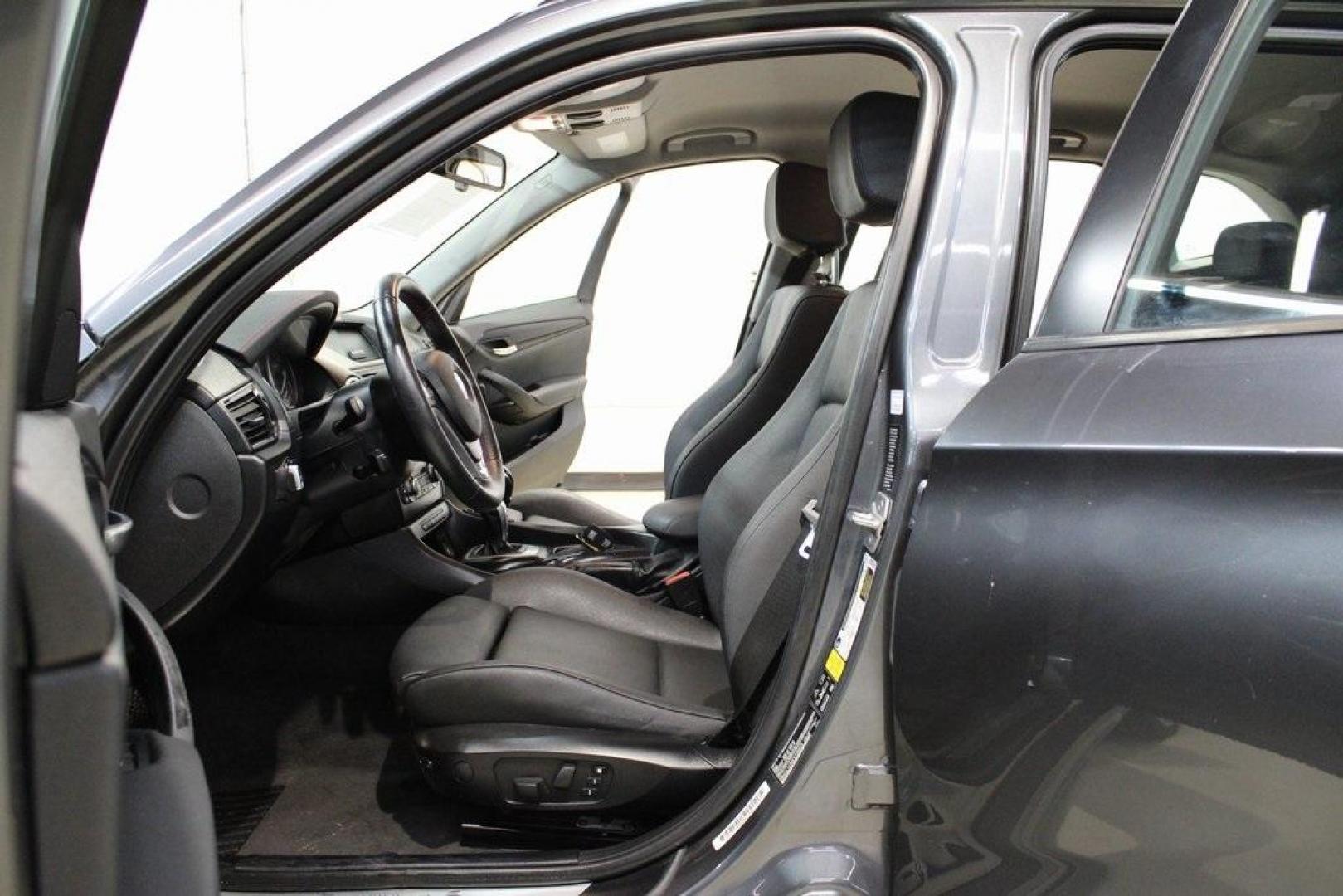 2015 Mineral Grey Metallic /Black BMW X1 xDrive28i (WBAVL1C56FV) with an 2.0L 4-Cylinder DOHC 16V TwinPower Turbo engine, Automatic transmission, located at 15300 Midway Rd., Addison, TX, 75001, (972) 702-0011, 32.958321, -96.838074 - Introducing the 2015 BMW X1 xDrive28i, now available at Midway Auto Group in Addison, Texas. This compact luxury SUV combines BMW's renowned performance with versatility and style, making it an excellent choice for both city driving and weekend adventures.<br><br>Key Features:<br><br>Engine: 2.0-lit - Photo#13