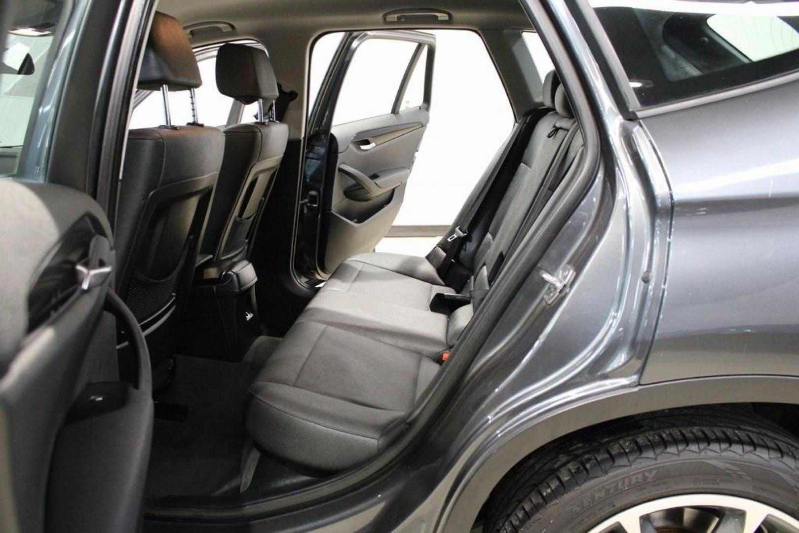 2015 Mineral Grey Metallic /Black BMW X1 xDrive28i (WBAVL1C56FV) with an 2.0L 4-Cylinder DOHC 16V TwinPower Turbo engine, Automatic transmission, located at 15300 Midway Rd., Addison, TX, 75001, (972) 702-0011, 32.958321, -96.838074 - Introducing the 2015 BMW X1 xDrive28i, now available at Midway Auto Group in Addison, Texas. This compact luxury SUV combines BMW's renowned performance with versatility and style, making it an excellent choice for both city driving and weekend adventures.<br><br>Key Features:<br><br>Engine: 2.0-lit - Photo#16