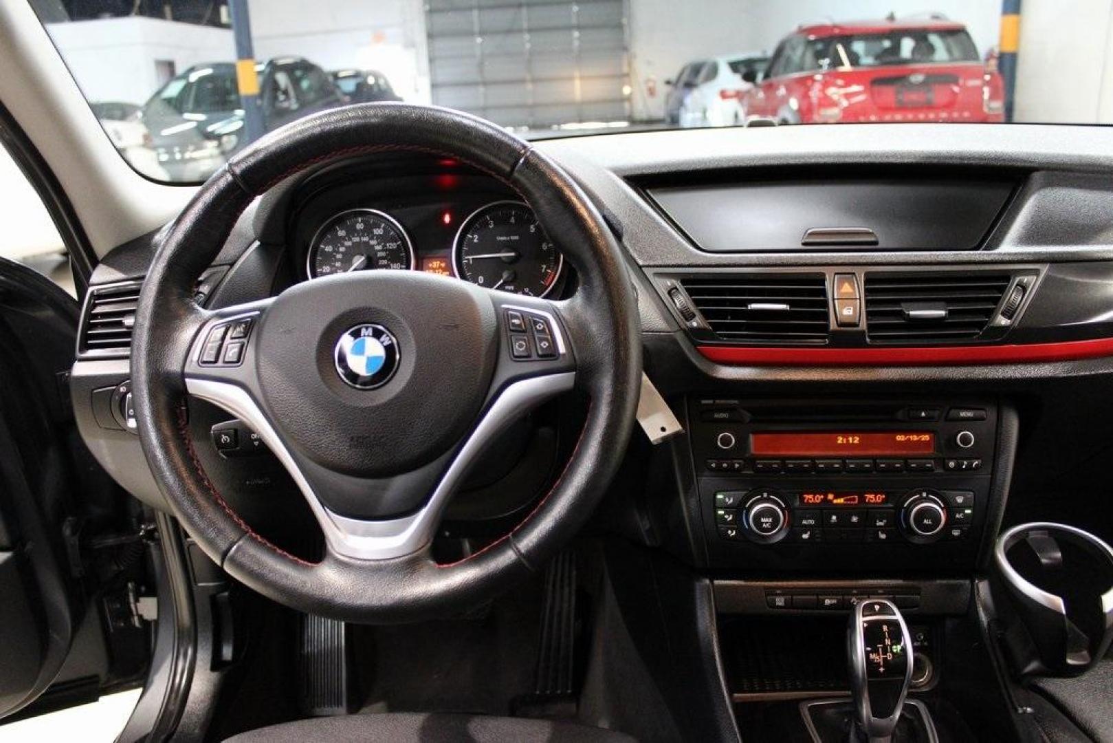 2015 Mineral Grey Metallic /Black BMW X1 xDrive28i (WBAVL1C56FV) with an 2.0L 4-Cylinder DOHC 16V TwinPower Turbo engine, Automatic transmission, located at 15300 Midway Rd., Addison, TX, 75001, (972) 702-0011, 32.958321, -96.838074 - Introducing the 2015 BMW X1 xDrive28i, now available at Midway Auto Group in Addison, Texas. This compact luxury SUV combines BMW's renowned performance with versatility and style, making it an excellent choice for both city driving and weekend adventures.<br><br>Key Features:<br><br>Engine: 2.0-lit - Photo#17