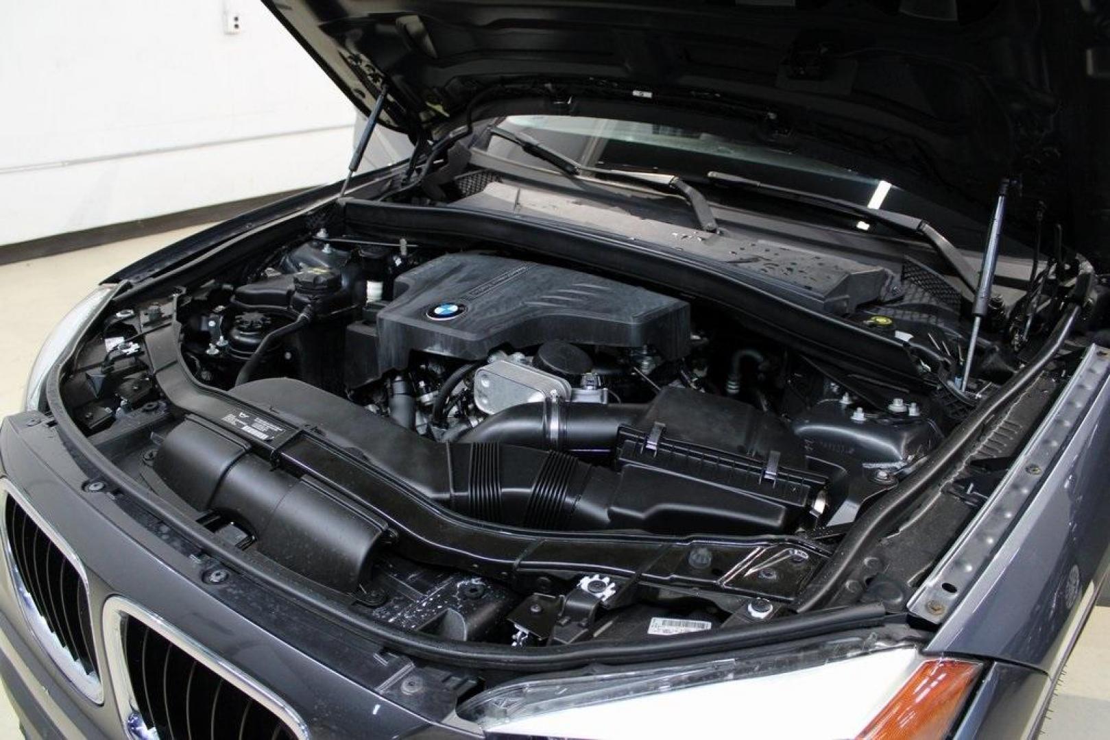 2015 Mineral Grey Metallic /Black BMW X1 xDrive28i (WBAVL1C56FV) with an 2.0L 4-Cylinder DOHC 16V TwinPower Turbo engine, Automatic transmission, located at 15300 Midway Rd., Addison, TX, 75001, (972) 702-0011, 32.958321, -96.838074 - Introducing the 2015 BMW X1 xDrive28i, now available at Midway Auto Group in Addison, Texas. This compact luxury SUV combines BMW's renowned performance with versatility and style, making it an excellent choice for both city driving and weekend adventures.<br><br>Key Features:<br><br>Engine: 2.0-lit - Photo#26