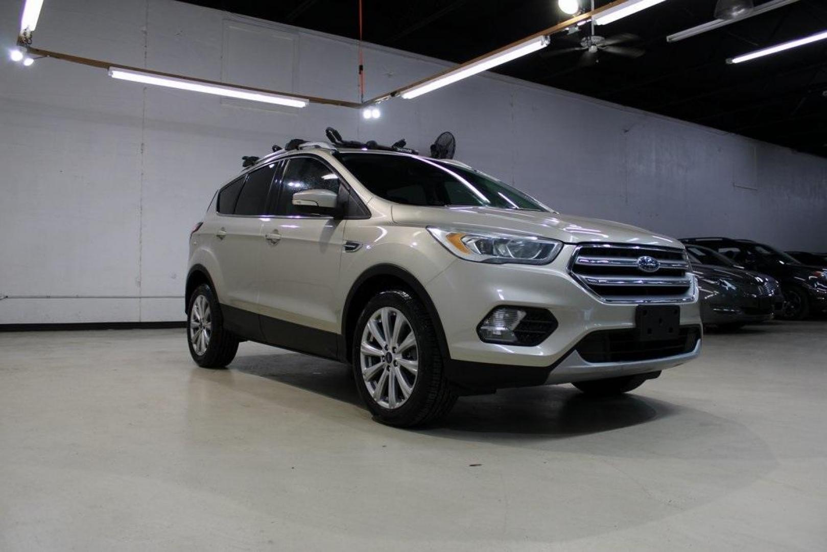 2017 White Gold /Charcoal Black Ford Escape Titanium (1FMCU0J91HU) with an EcoBoost 2.0L I4 GTDi DOHC Turbocharged VCT engine, Automatic transmission, located at 15300 Midway Rd., Addison, TX, 75001, (972) 702-0011, 32.958321, -96.838074 - Photo#1