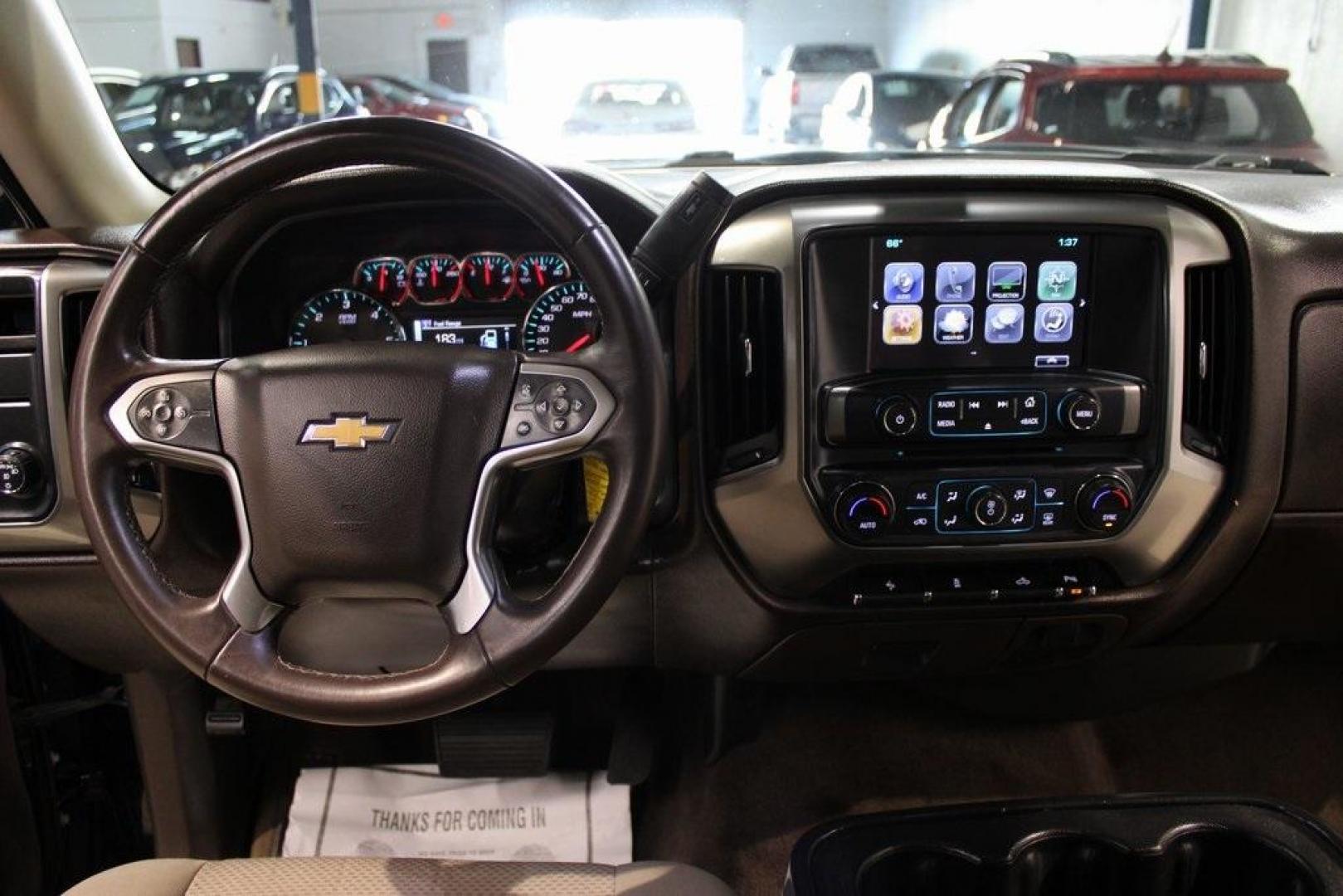2017 Black /Cocoa/Dune Chevrolet Silverado 1500 LT (3GCPCREC5HG) with an EcoTec3 5.3L V8 engine, Automatic transmission, located at 15300 Midway Rd., Addison, TX, 75001, (972) 702-0011, 32.958321, -96.838074 - HOME OF THE NO HAGGLE PRICE - WHOLESALE PRICES TO THE PUBLIC!! Silverado 1500 LT LT1, 4D Crew Cab, EcoTec3 5.3L V8, 6-Speed Automatic Electronic with Overdrive, RWD, Black, Cocoa/Dune Cloth. Odometer is 1392 miles below market average!<br><br>Black 2017 Chevrolet Silverado 1500 LT<br><br><br>Awards: - Photo#17