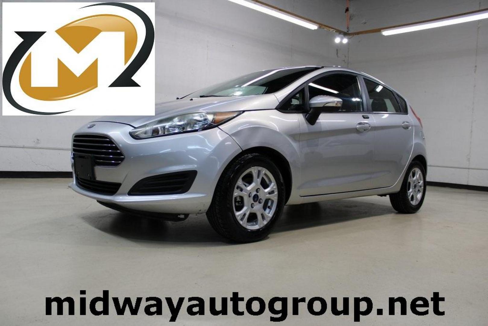 2016 Ingot Silver /Black Ford Fiesta SE (3FADP4EJ0GM) with an 1.6L I4 Ti-VCT engine, Automatic transmission, located at 15300 Midway Rd., Addison, TX, 75001, (972) 702-0011, 32.958321, -96.838074 - Introducing the 2016 Ford Fiesta SE, now available at Midway Auto Group in Addison, Texas. This compact sedan offers a perfect blend of efficiency, modern features, and spirited performance, making it an excellent choice for both city commutes and weekend adventures.<br><br>Key Features:<br><br>Engi - Photo#0