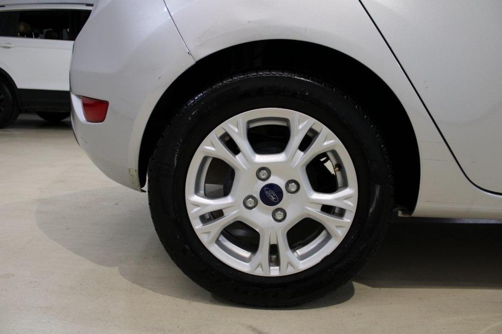 2016 Ingot Silver /Black Ford Fiesta SE (3FADP4EJ0GM) with an 1.6L I4 Ti-VCT engine, Automatic transmission, located at 15300 Midway Rd., Addison, TX, 75001, (972) 702-0011, 32.958321, -96.838074 - Introducing the 2016 Ford Fiesta SE, now available at Midway Auto Group in Addison, Texas. This compact sedan offers a perfect blend of efficiency, modern features, and spirited performance, making it an excellent choice for both city commutes and weekend adventures.<br><br>Key Features:<br><br>Engi - Photo#10