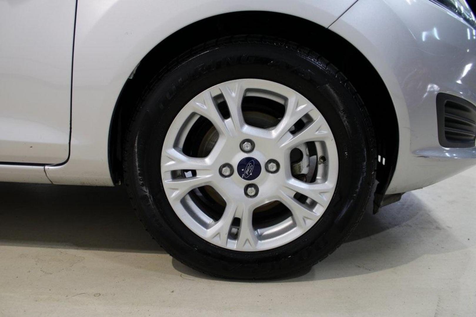 2016 Ingot Silver /Black Ford Fiesta SE (3FADP4EJ0GM) with an 1.6L I4 Ti-VCT engine, Automatic transmission, located at 15300 Midway Rd., Addison, TX, 75001, (972) 702-0011, 32.958321, -96.838074 - Introducing the 2016 Ford Fiesta SE, now available at Midway Auto Group in Addison, Texas. This compact sedan offers a perfect blend of efficiency, modern features, and spirited performance, making it an excellent choice for both city commutes and weekend adventures.<br><br>Key Features:<br><br>Engi - Photo#11