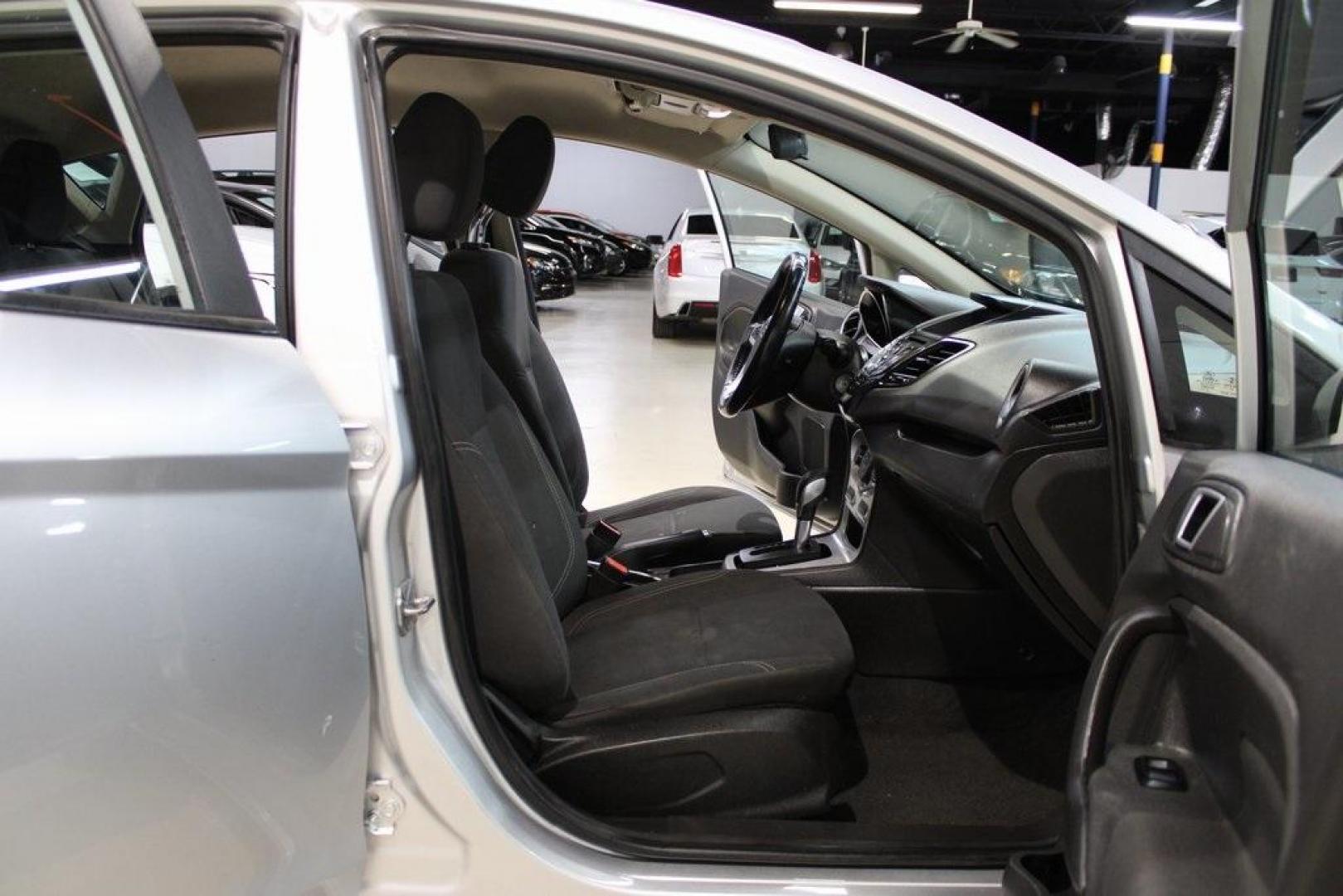 2016 Ingot Silver /Black Ford Fiesta SE (3FADP4EJ0GM) with an 1.6L I4 Ti-VCT engine, Automatic transmission, located at 15300 Midway Rd., Addison, TX, 75001, (972) 702-0011, 32.958321, -96.838074 - Introducing the 2016 Ford Fiesta SE, now available at Midway Auto Group in Addison, Texas. This compact sedan offers a perfect blend of efficiency, modern features, and spirited performance, making it an excellent choice for both city commutes and weekend adventures.<br><br>Key Features:<br><br>Engi - Photo#12
