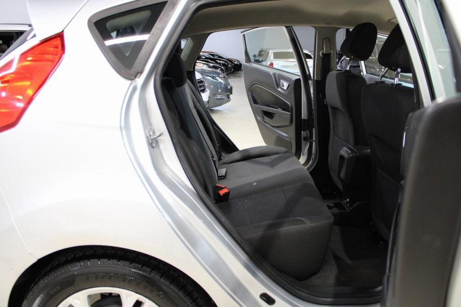 2016 Ingot Silver /Black Ford Fiesta SE (3FADP4EJ0GM) with an 1.6L I4 Ti-VCT engine, Automatic transmission, located at 15300 Midway Rd., Addison, TX, 75001, (972) 702-0011, 32.958321, -96.838074 - Introducing the 2016 Ford Fiesta SE, now available at Midway Auto Group in Addison, Texas. This compact sedan offers a perfect blend of efficiency, modern features, and spirited performance, making it an excellent choice for both city commutes and weekend adventures.<br><br>Key Features:<br><br>Engi - Photo#13
