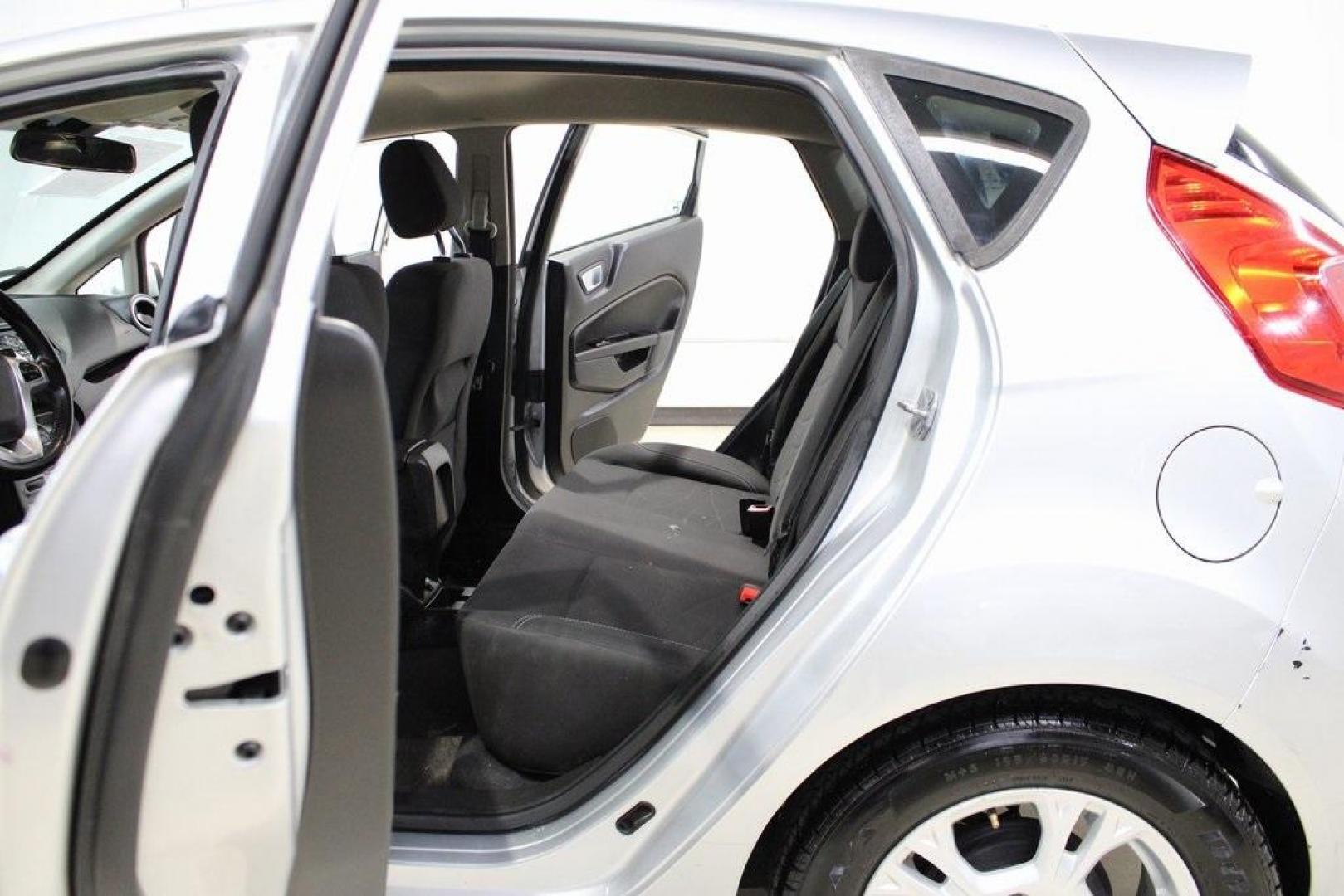 2016 Ingot Silver /Black Ford Fiesta SE (3FADP4EJ0GM) with an 1.6L I4 Ti-VCT engine, Automatic transmission, located at 15300 Midway Rd., Addison, TX, 75001, (972) 702-0011, 32.958321, -96.838074 - Introducing the 2016 Ford Fiesta SE, now available at Midway Auto Group in Addison, Texas. This compact sedan offers a perfect blend of efficiency, modern features, and spirited performance, making it an excellent choice for both city commutes and weekend adventures.<br><br>Key Features:<br><br>Engi - Photo#15