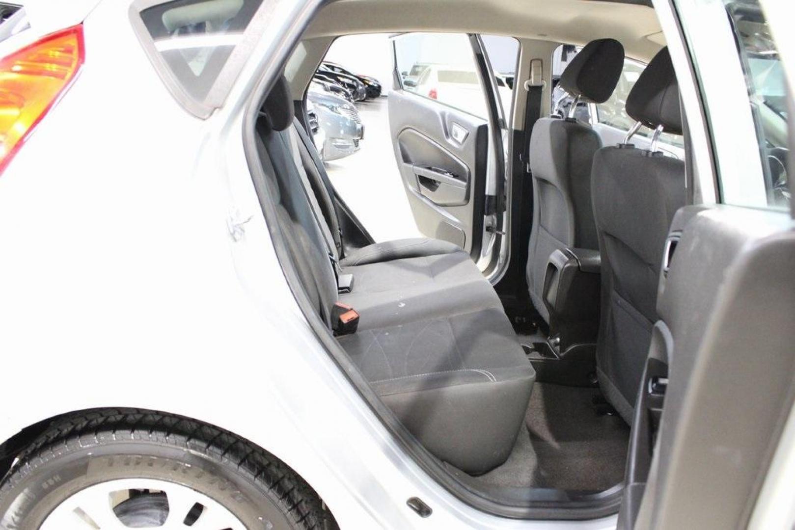 2016 Ingot Silver /Black Ford Fiesta SE (3FADP4EJ0GM) with an 1.6L I4 Ti-VCT engine, Automatic transmission, located at 15300 Midway Rd., Addison, TX, 75001, (972) 702-0011, 32.958321, -96.838074 - Introducing the 2016 Ford Fiesta SE, now available at Midway Auto Group in Addison, Texas. This compact sedan offers a perfect blend of efficiency, modern features, and spirited performance, making it an excellent choice for both city commutes and weekend adventures.<br><br>Key Features:<br><br>Engi - Photo#16