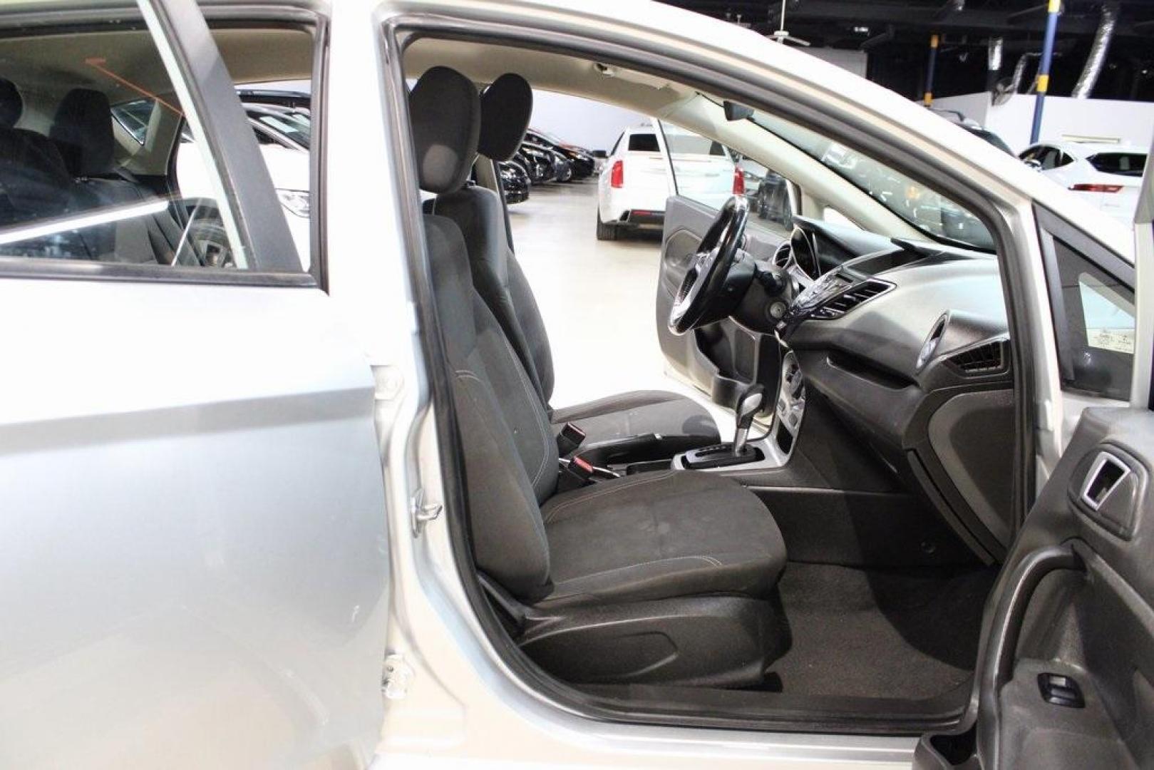 2016 Ingot Silver /Black Ford Fiesta SE (3FADP4EJ0GM) with an 1.6L I4 Ti-VCT engine, Automatic transmission, located at 15300 Midway Rd., Addison, TX, 75001, (972) 702-0011, 32.958321, -96.838074 - Introducing the 2016 Ford Fiesta SE, now available at Midway Auto Group in Addison, Texas. This compact sedan offers a perfect blend of efficiency, modern features, and spirited performance, making it an excellent choice for both city commutes and weekend adventures.<br><br>Key Features:<br><br>Engi - Photo#17