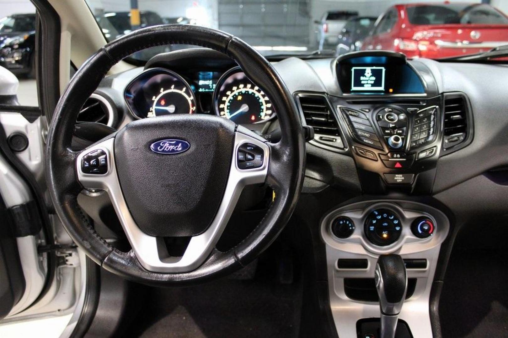 2016 Ingot Silver /Black Ford Fiesta SE (3FADP4EJ0GM) with an 1.6L I4 Ti-VCT engine, Automatic transmission, located at 15300 Midway Rd., Addison, TX, 75001, (972) 702-0011, 32.958321, -96.838074 - Introducing the 2016 Ford Fiesta SE, now available at Midway Auto Group in Addison, Texas. This compact sedan offers a perfect blend of efficiency, modern features, and spirited performance, making it an excellent choice for both city commutes and weekend adventures.<br><br>Key Features:<br><br>Engi - Photo#18