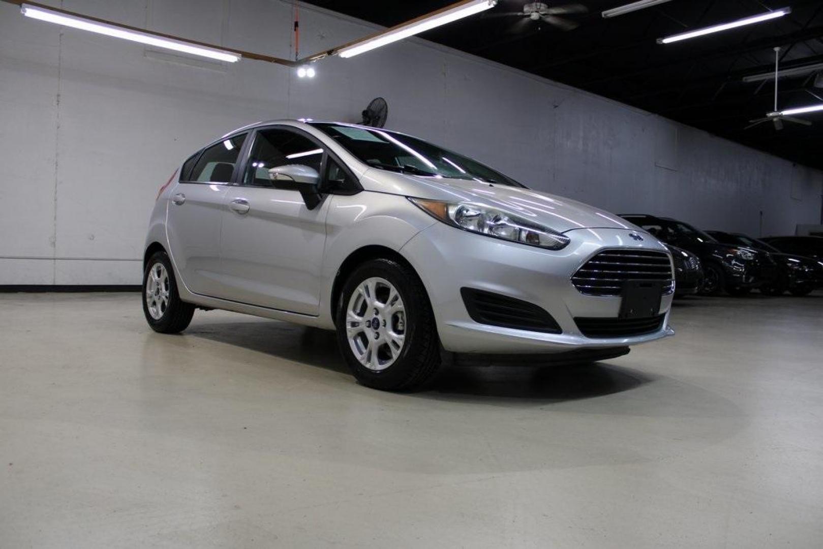 2016 Ingot Silver /Black Ford Fiesta SE (3FADP4EJ0GM) with an 1.6L I4 Ti-VCT engine, Automatic transmission, located at 15300 Midway Rd., Addison, TX, 75001, (972) 702-0011, 32.958321, -96.838074 - Introducing the 2016 Ford Fiesta SE, now available at Midway Auto Group in Addison, Texas. This compact sedan offers a perfect blend of efficiency, modern features, and spirited performance, making it an excellent choice for both city commutes and weekend adventures.<br><br>Key Features:<br><br>Engi - Photo#1
