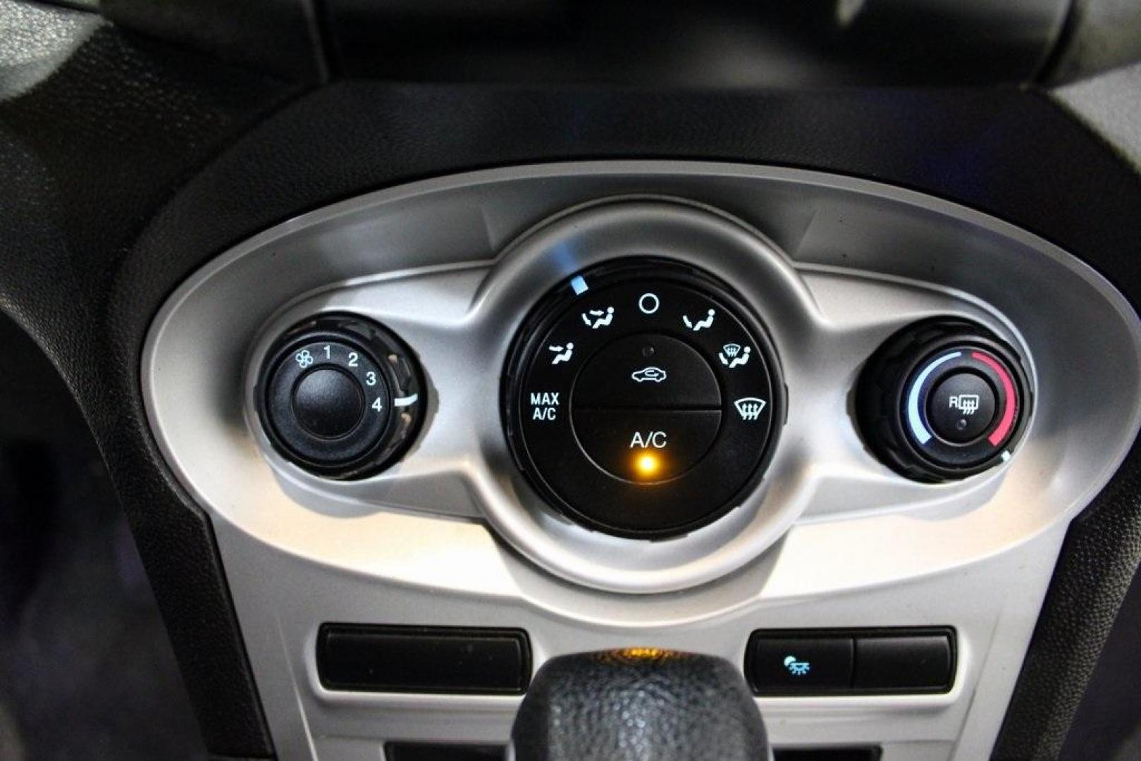 2016 Ingot Silver /Black Ford Fiesta SE (3FADP4EJ0GM) with an 1.6L I4 Ti-VCT engine, Automatic transmission, located at 15300 Midway Rd., Addison, TX, 75001, (972) 702-0011, 32.958321, -96.838074 - Introducing the 2016 Ford Fiesta SE, now available at Midway Auto Group in Addison, Texas. This compact sedan offers a perfect blend of efficiency, modern features, and spirited performance, making it an excellent choice for both city commutes and weekend adventures.<br><br>Key Features:<br><br>Engi - Photo#21