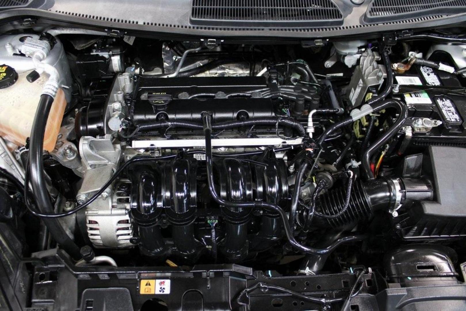 2016 Ingot Silver /Black Ford Fiesta SE (3FADP4EJ0GM) with an 1.6L I4 Ti-VCT engine, Automatic transmission, located at 15300 Midway Rd., Addison, TX, 75001, (972) 702-0011, 32.958321, -96.838074 - Introducing the 2016 Ford Fiesta SE, now available at Midway Auto Group in Addison, Texas. This compact sedan offers a perfect blend of efficiency, modern features, and spirited performance, making it an excellent choice for both city commutes and weekend adventures.<br><br>Key Features:<br><br>Engi - Photo#27