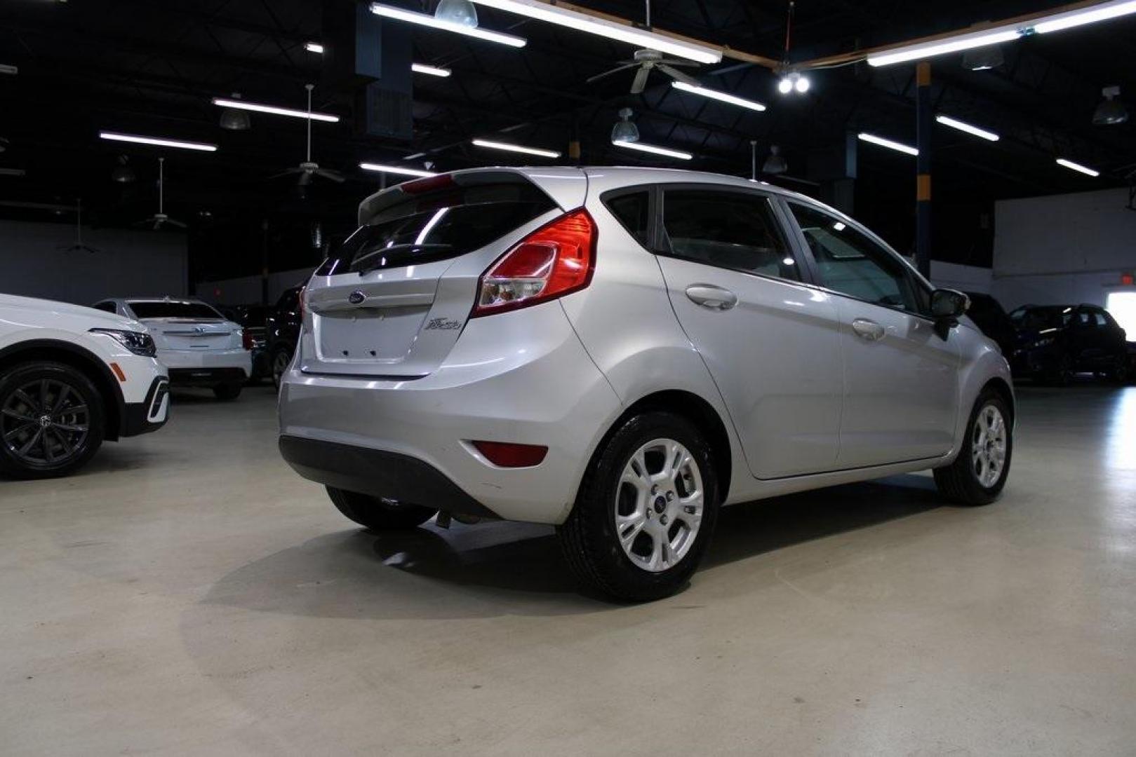 2016 Ingot Silver /Black Ford Fiesta SE (3FADP4EJ0GM) with an 1.6L I4 Ti-VCT engine, Automatic transmission, located at 15300 Midway Rd., Addison, TX, 75001, (972) 702-0011, 32.958321, -96.838074 - Introducing the 2016 Ford Fiesta SE, now available at Midway Auto Group in Addison, Texas. This compact sedan offers a perfect blend of efficiency, modern features, and spirited performance, making it an excellent choice for both city commutes and weekend adventures.<br><br>Key Features:<br><br>Engi - Photo#2