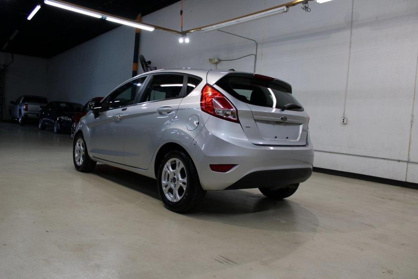2016 Ingot Silver /Black Ford Fiesta SE (3FADP4EJ0GM) with an 1.6L I4 Ti-VCT engine, Automatic transmission, located at 15300 Midway Rd., Addison, TX, 75001, (972) 702-0011, 32.958321, -96.838074 - Introducing the 2016 Ford Fiesta SE, now available at Midway Auto Group in Addison, Texas. This compact sedan offers a perfect blend of efficiency, modern features, and spirited performance, making it an excellent choice for both city commutes and weekend adventures.<br><br>Key Features:<br><br>Engi - Photo#3