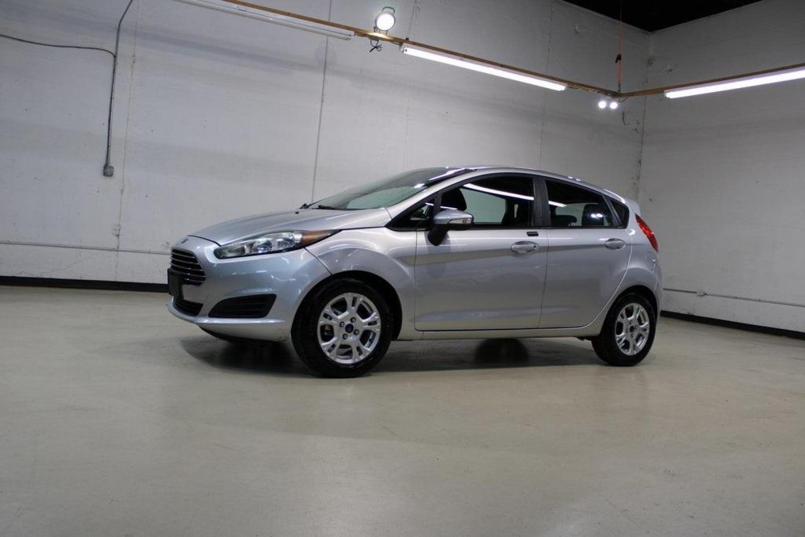 2016 Ingot Silver /Black Ford Fiesta SE (3FADP4EJ0GM) with an 1.6L I4 Ti-VCT engine, Automatic transmission, located at 15300 Midway Rd., Addison, TX, 75001, (972) 702-0011, 32.958321, -96.838074 - Introducing the 2016 Ford Fiesta SE, now available at Midway Auto Group in Addison, Texas. This compact sedan offers a perfect blend of efficiency, modern features, and spirited performance, making it an excellent choice for both city commutes and weekend adventures.<br><br>Key Features:<br><br>Engi - Photo#4